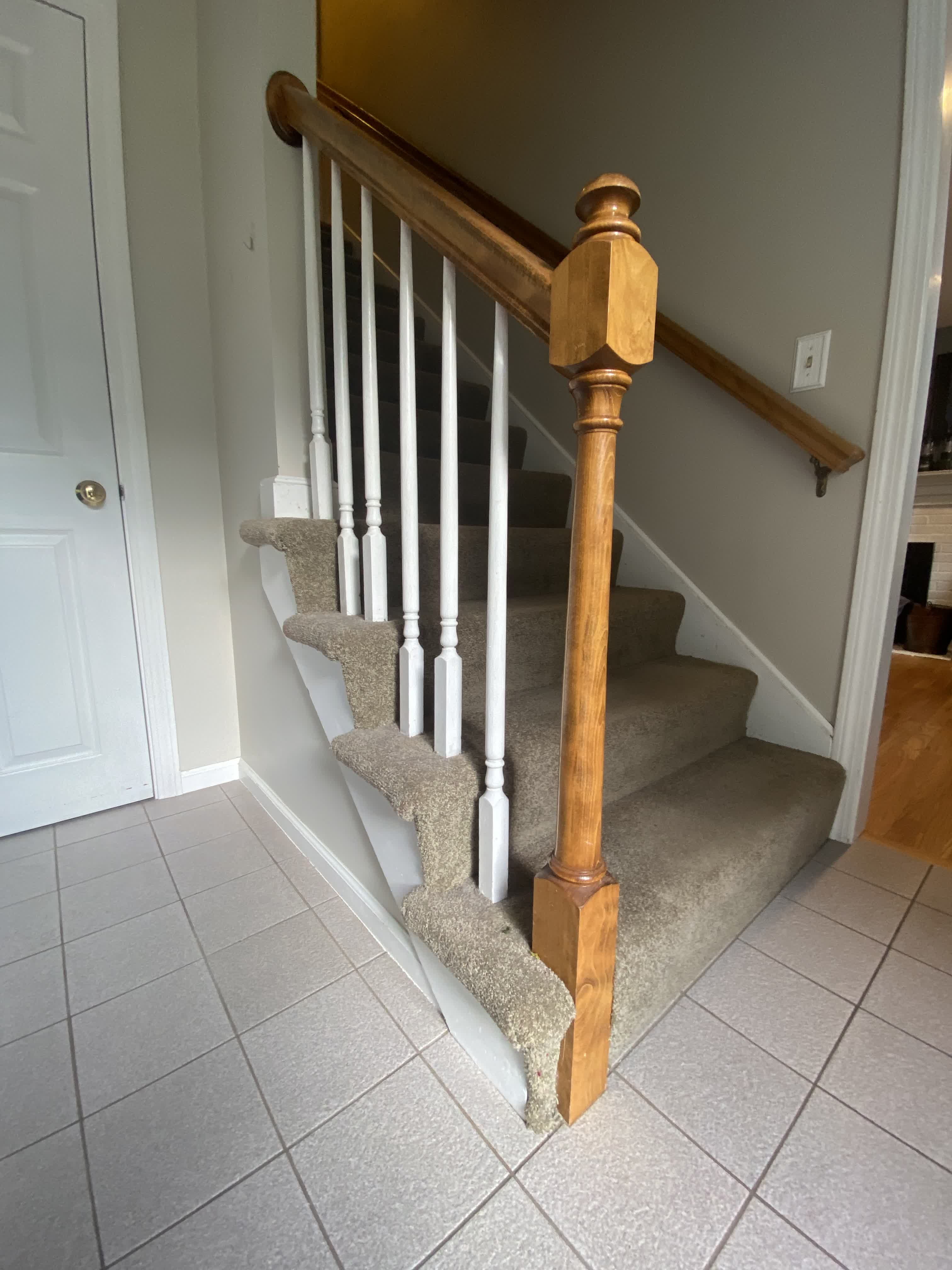 Wrentham MA — staircase before renovation, side angle showing original turned newel post and white spindle detail