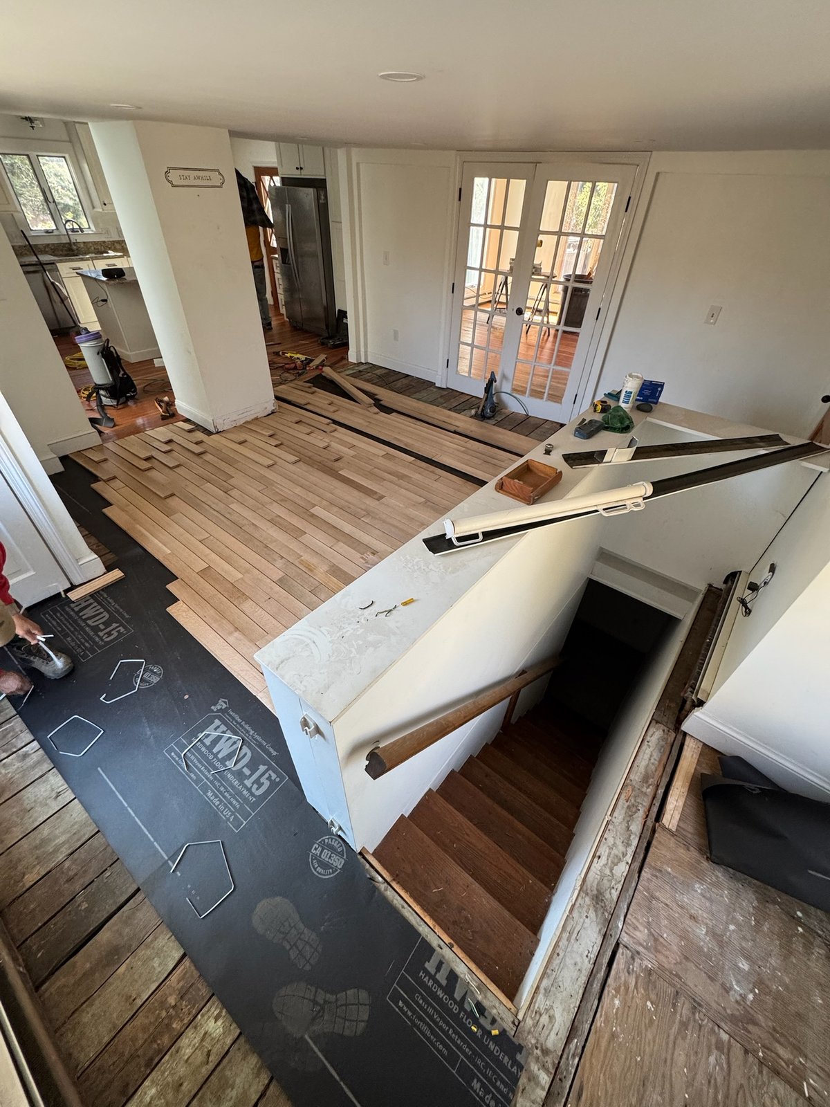 Middletown RI — subfloor preparation with HWD-15 underlayment as new white oak installation begins