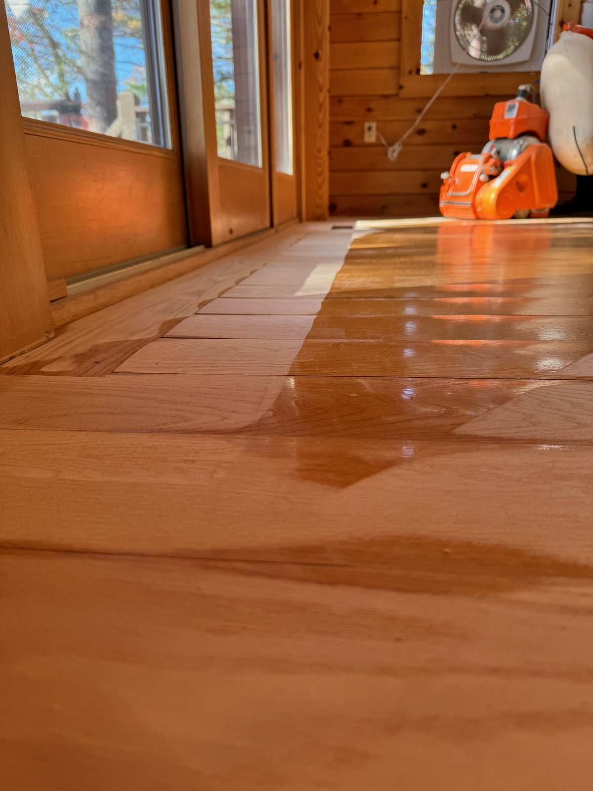 Killingly CT — sanding process with orange Taurus floor machine in frame during lake cabin restoration