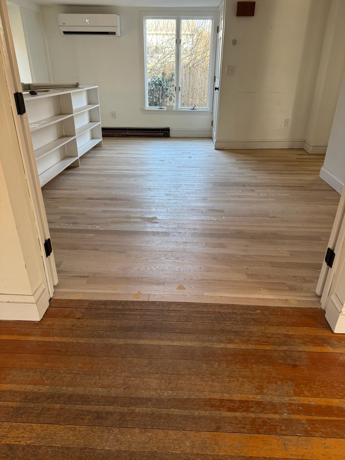 Middletown RI — new white oak beside preserved existing heart pine, contrast before final finish