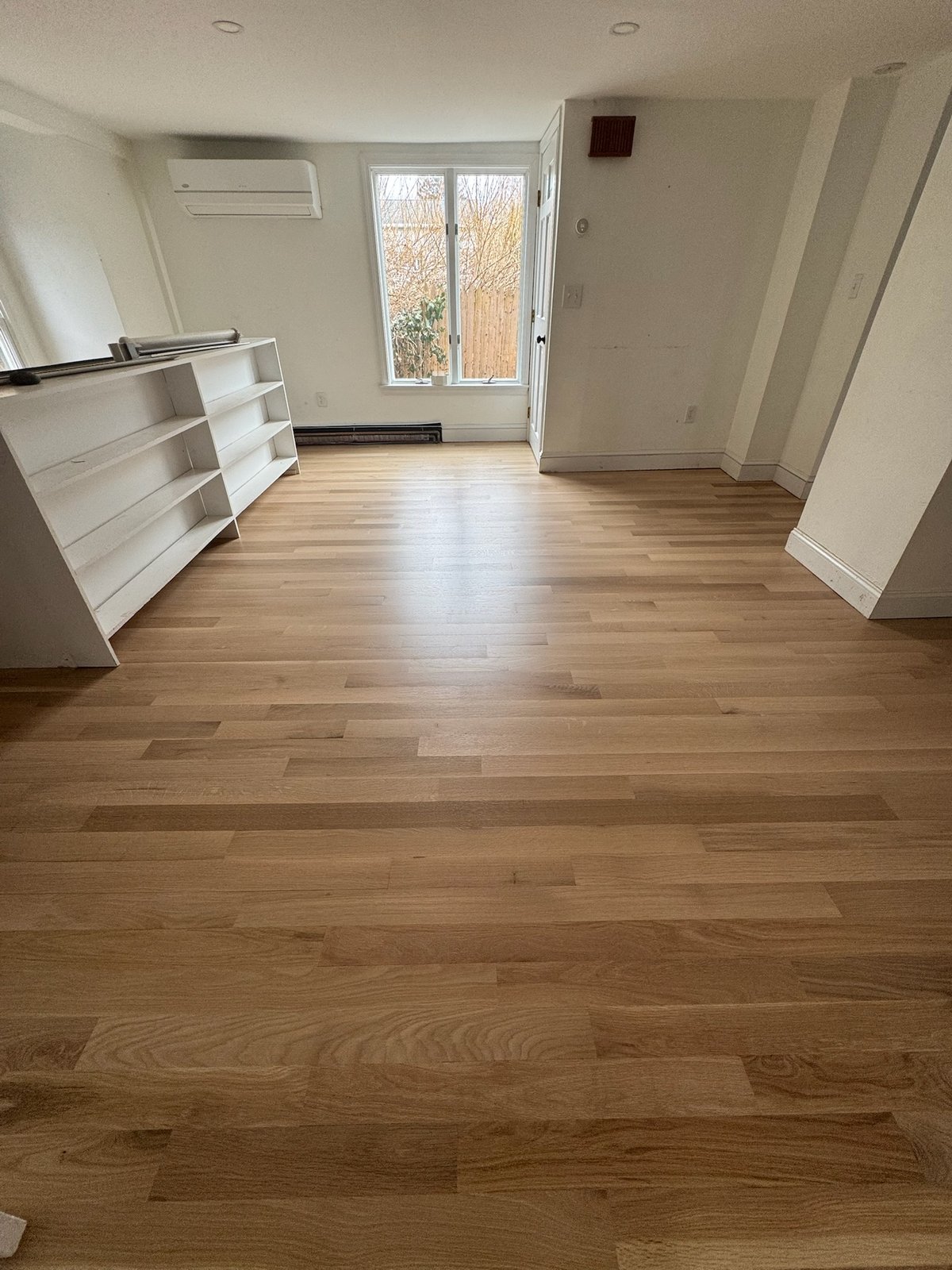 Middletown RI — finished clean empty room showing the restored hardwood floor, alternate hero angle