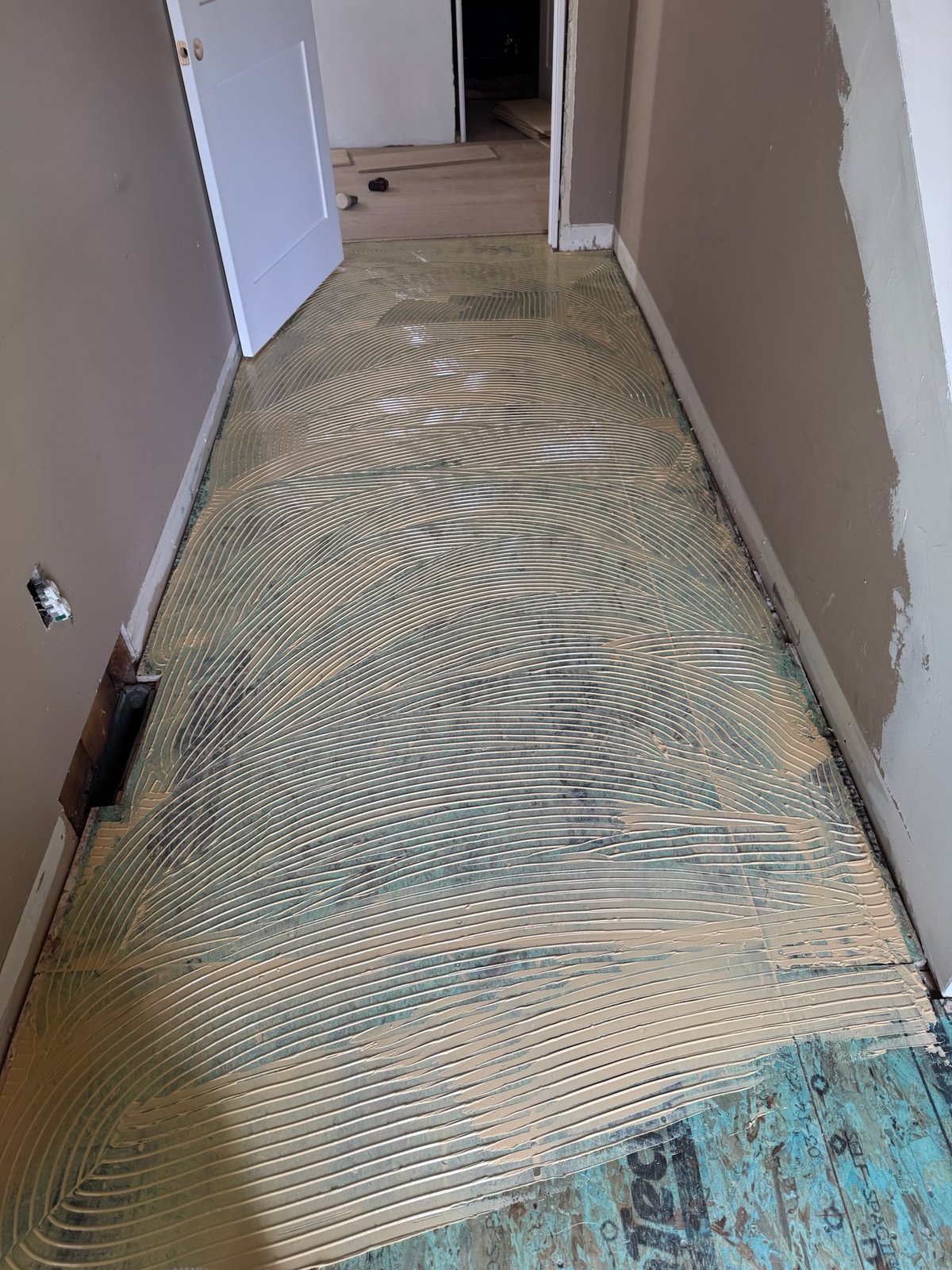 North Kingstown RI — full-spread trowel glue-down installation of wide-plank European white oak