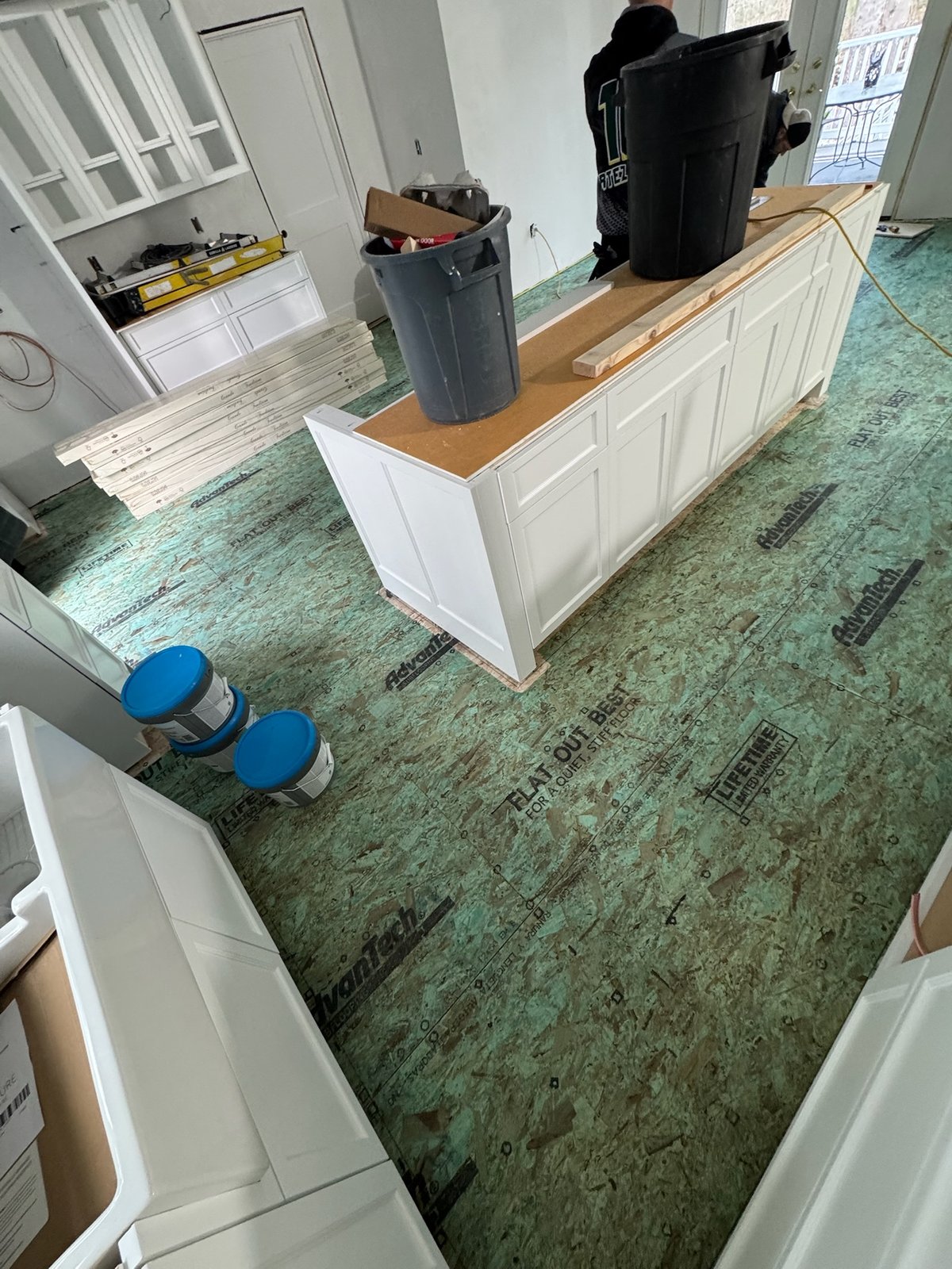 North Kingstown RI — subfloor prepared in kitchen before wide-plank white oak installation