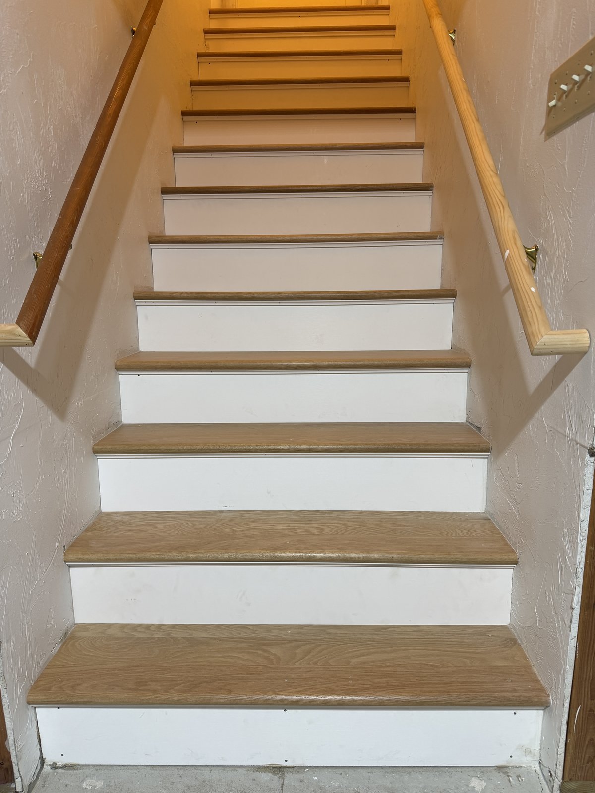 Cranston RI — finished white oak staircase with white primed risers, solid oak treads, and decorative cove molding