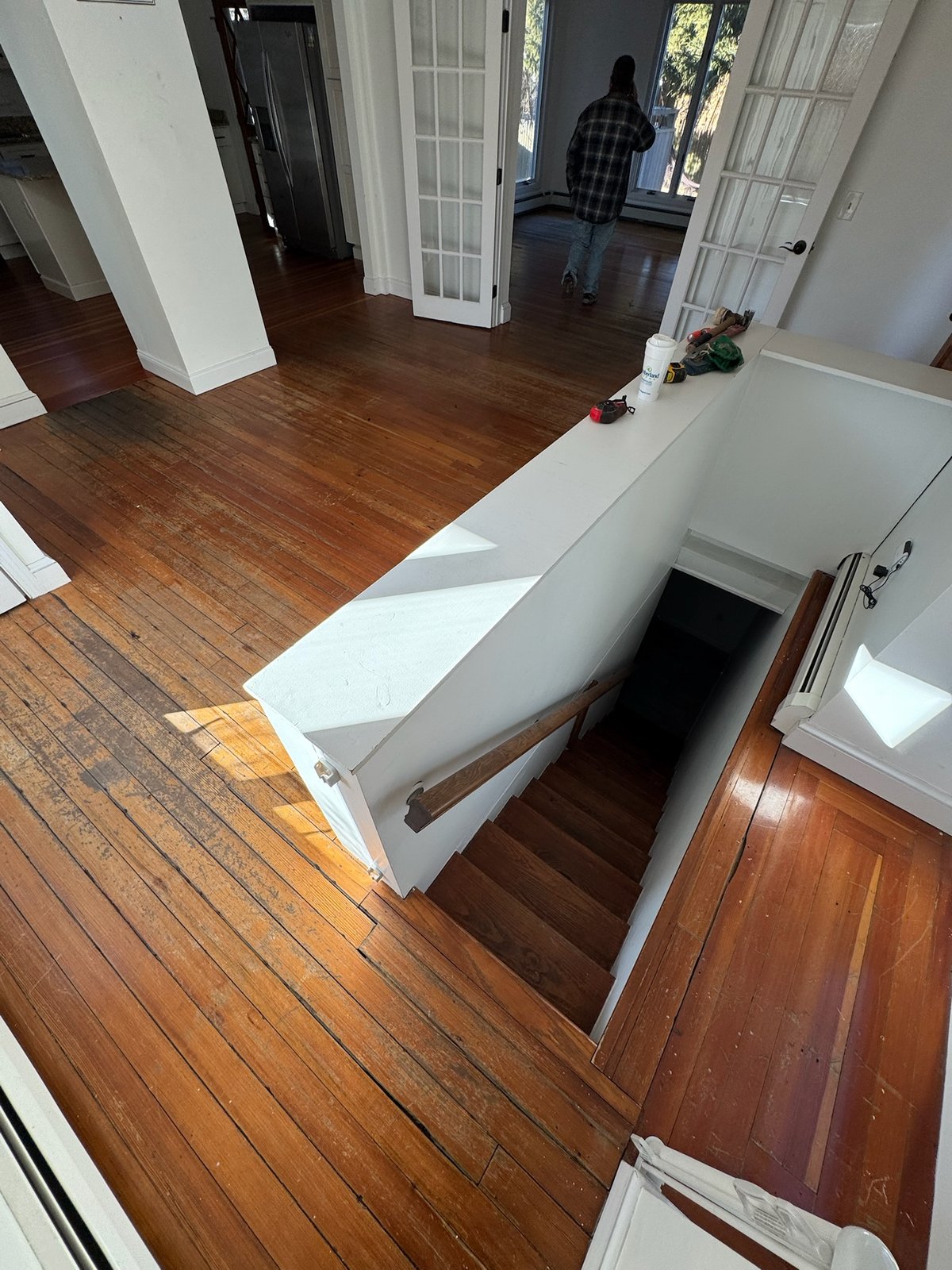 Middletown RI — existing worn hardwood with staircase included in the restoration scope