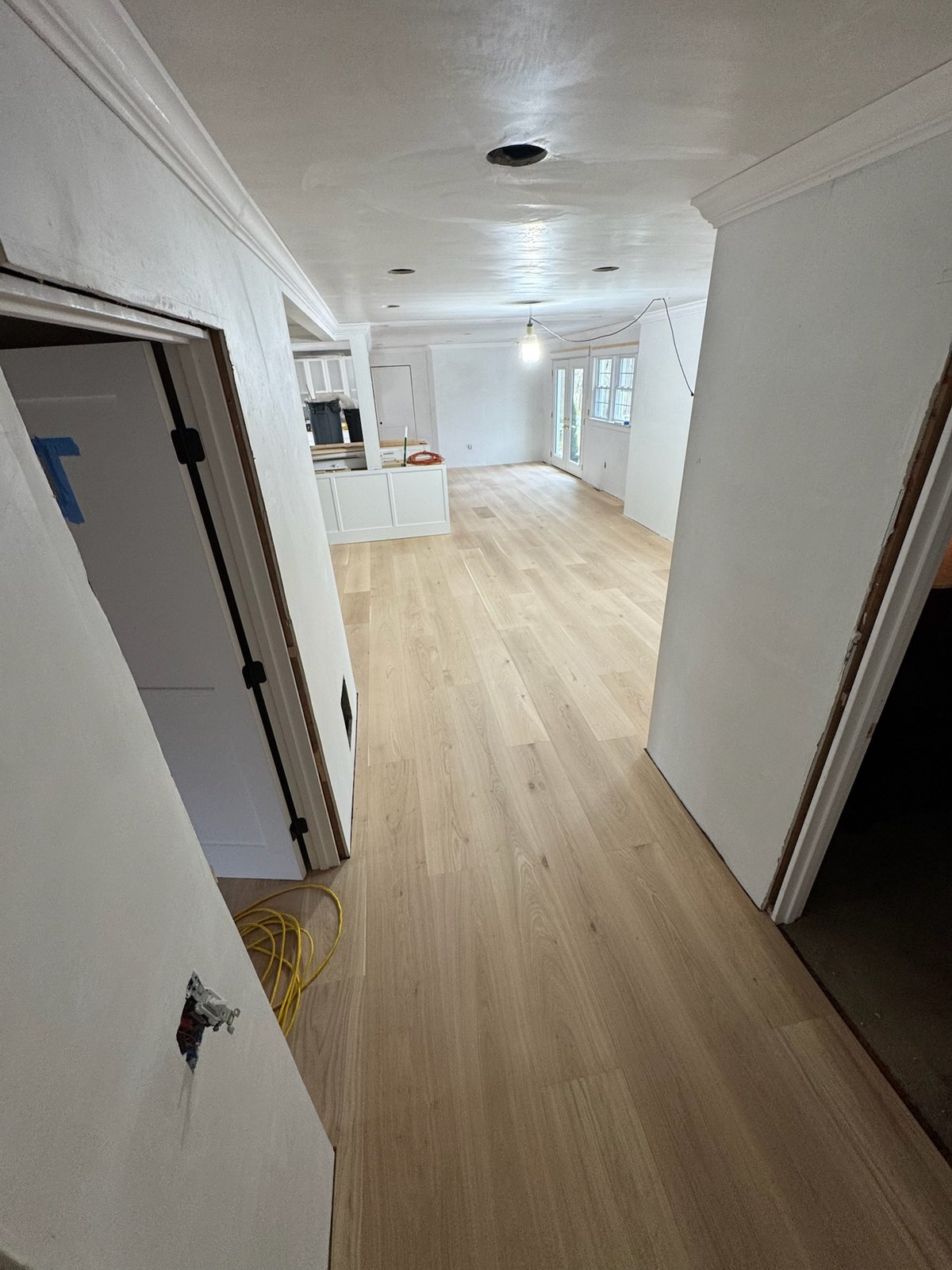 North Kingstown RI — raw installed wide-plank white oak floor before on-site finishing, angle two