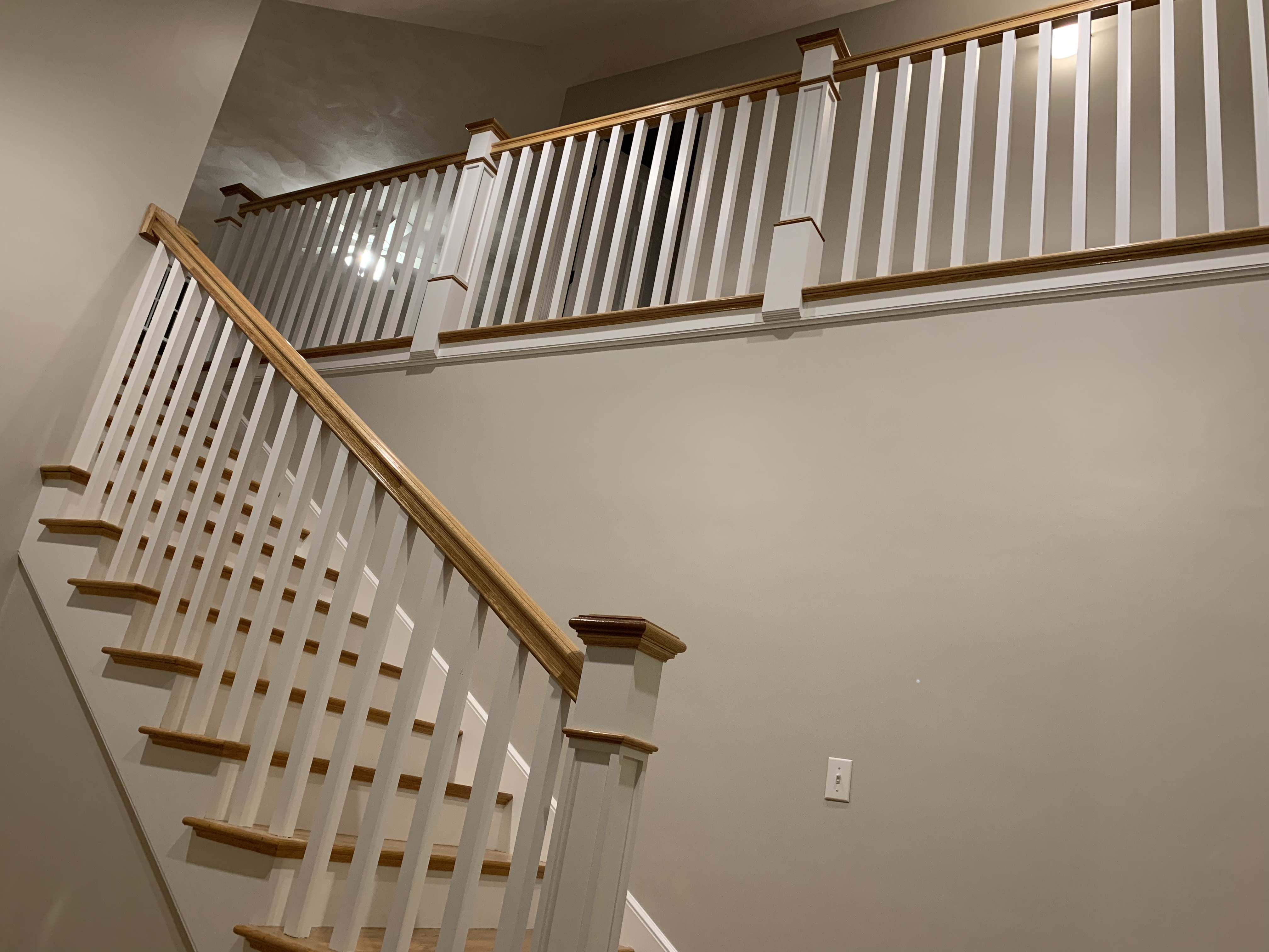 Custom staircase with oak treads and white balusters