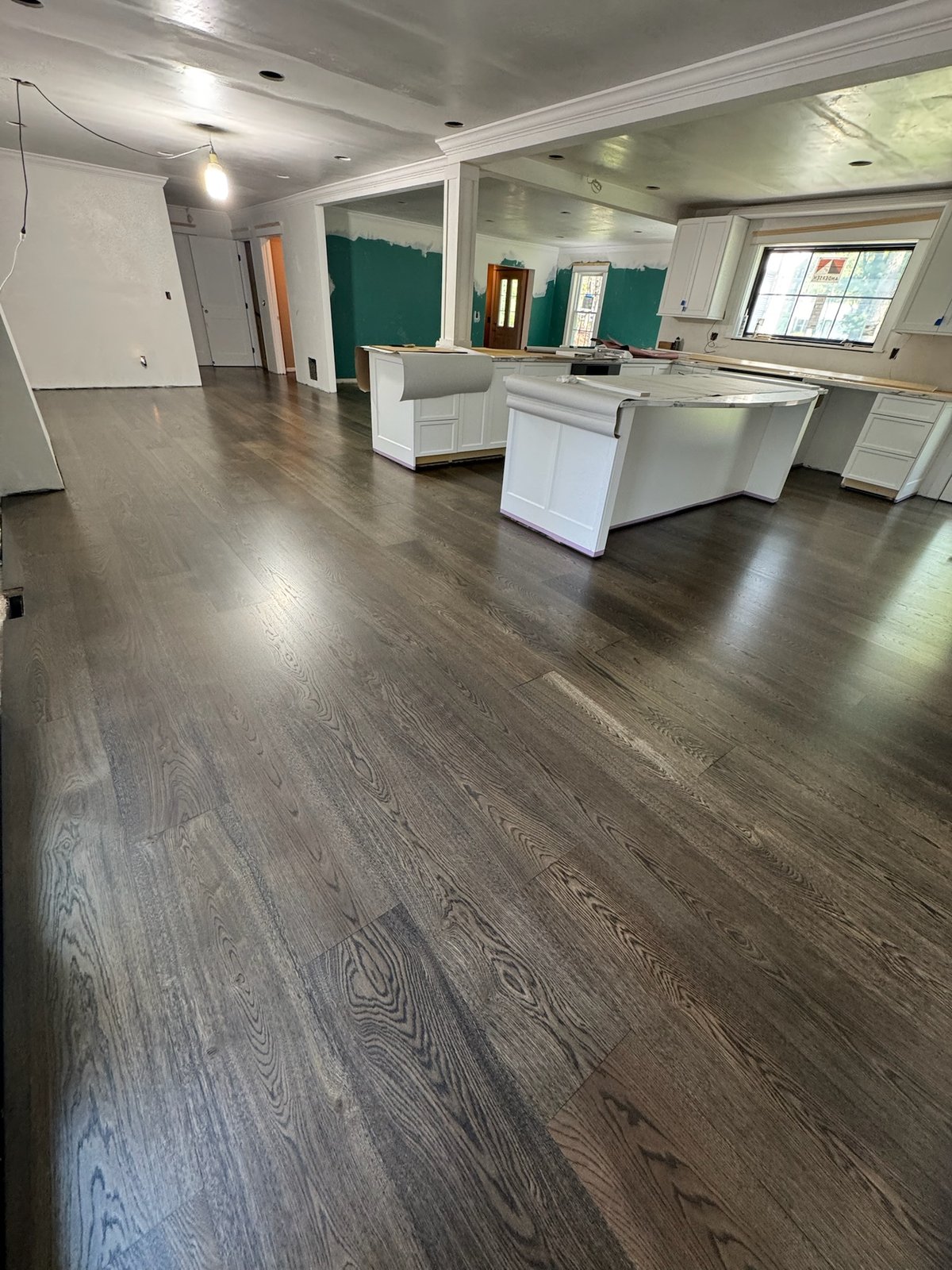North Kingstown RI — wide-plank white oak stained and finished on site to a deep, rich color