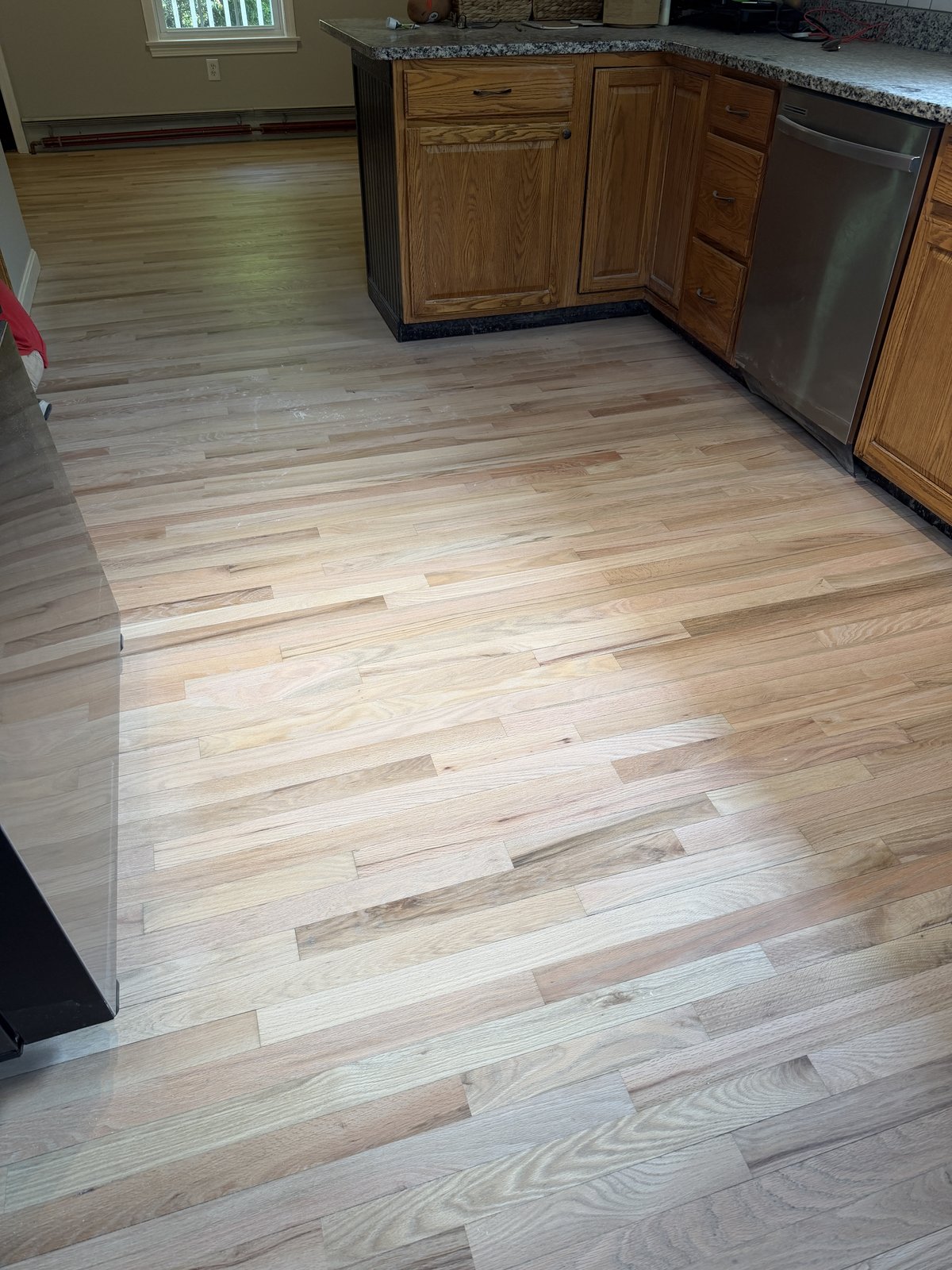 Coventry RI — raw sanded kitchen floor after factory finish removal, ready for finish