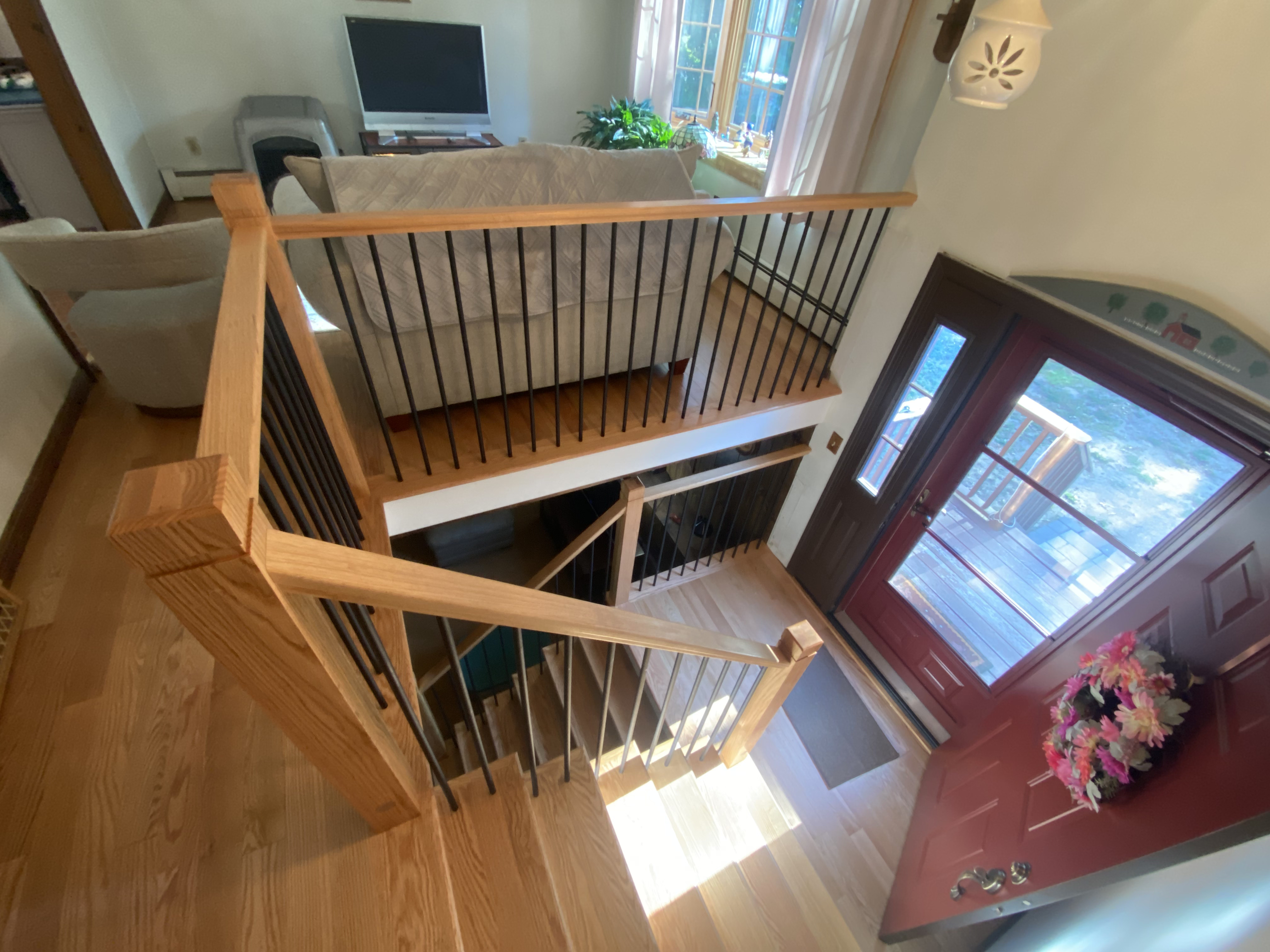 Custom staircase installation in progress — light oak treads being set