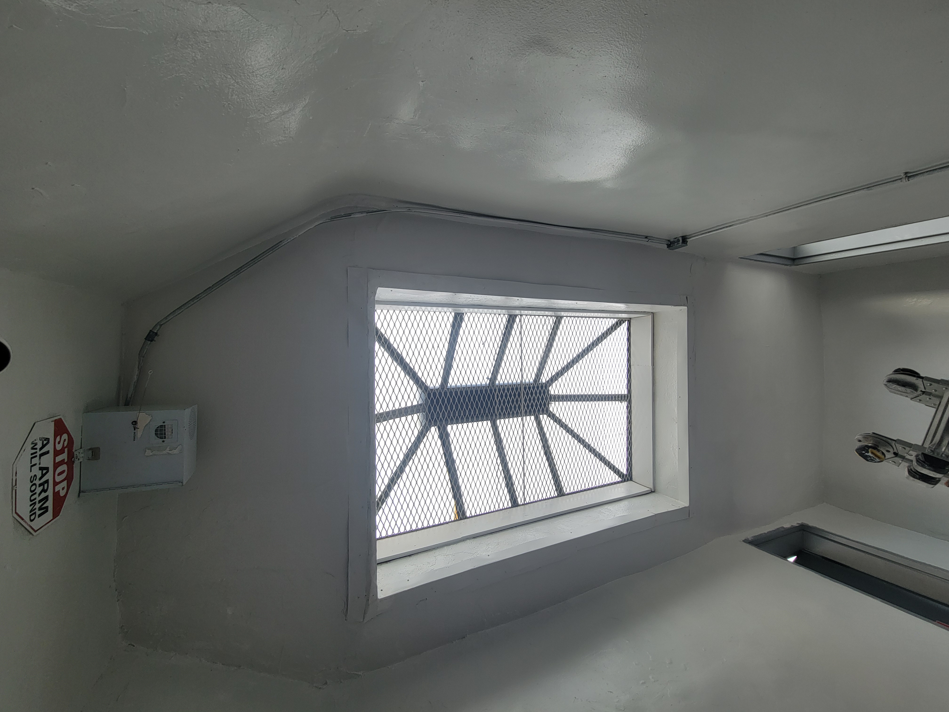 Freshly painted stairwell with skylight by Strictly Paint LLC