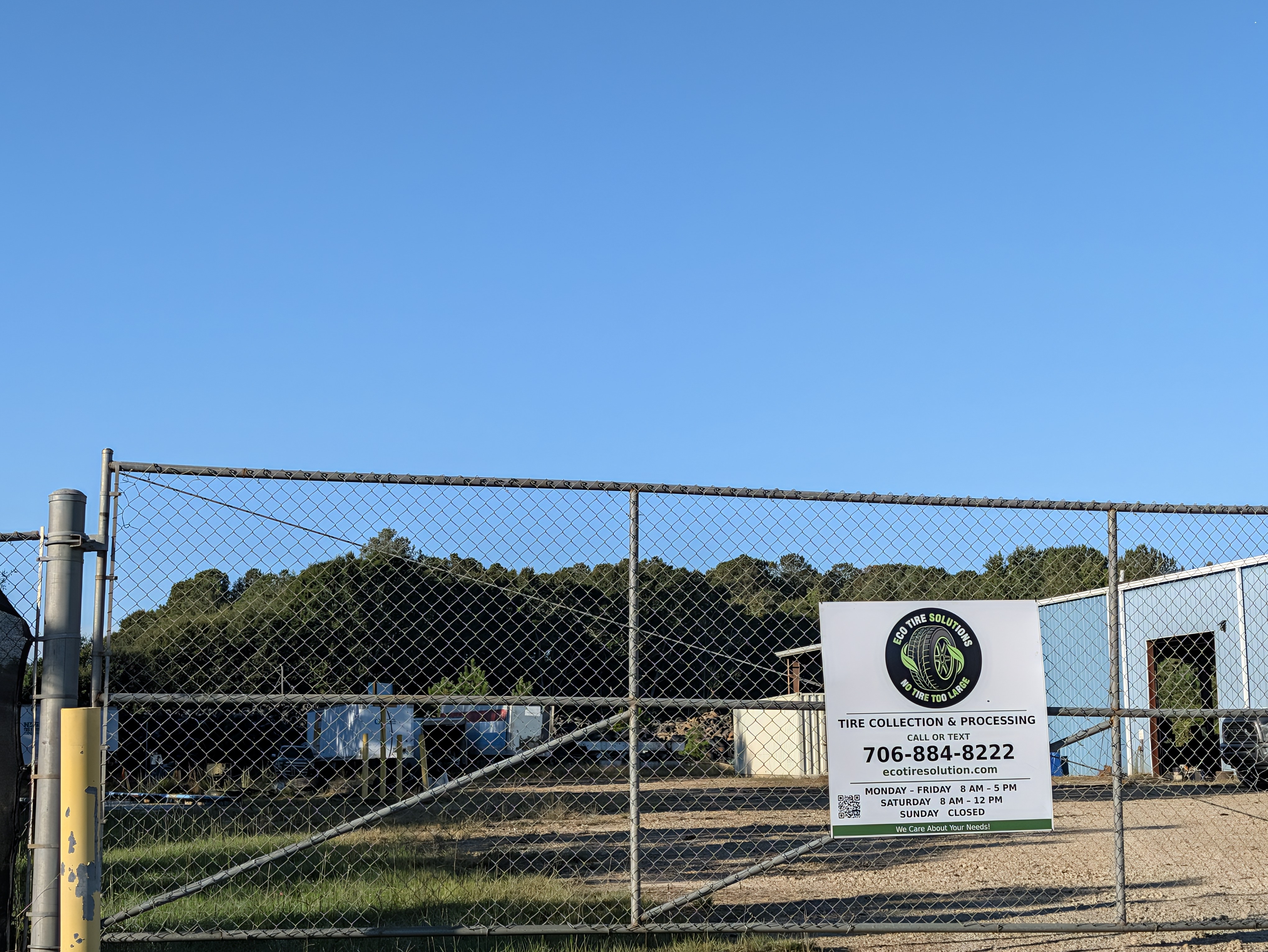 Eco Tire Solutions Hartwell GA facility entrance with company sign showing hours and phone number