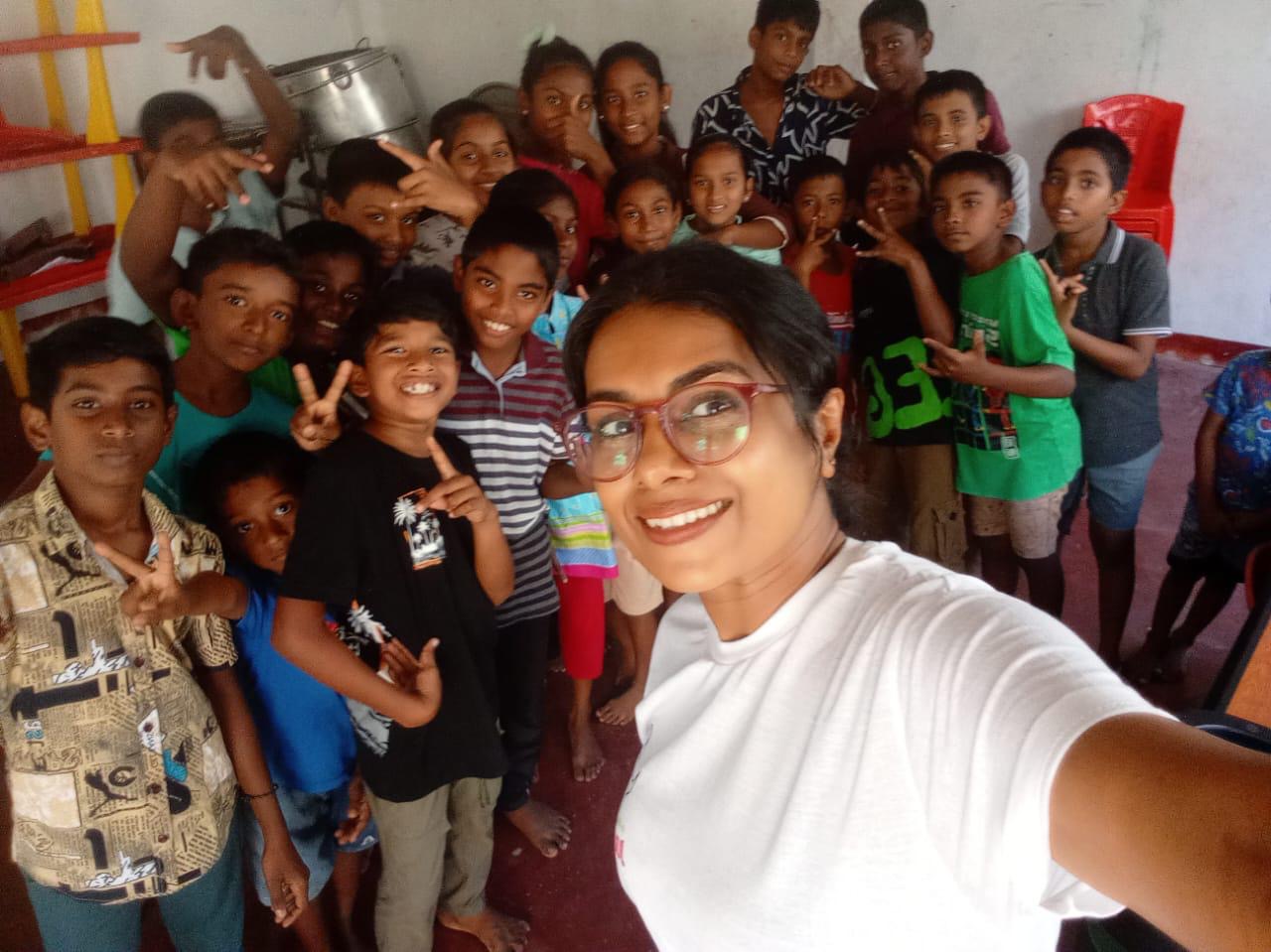 Jeremiah James with children at Mighty Step Academy in Sri Lanka