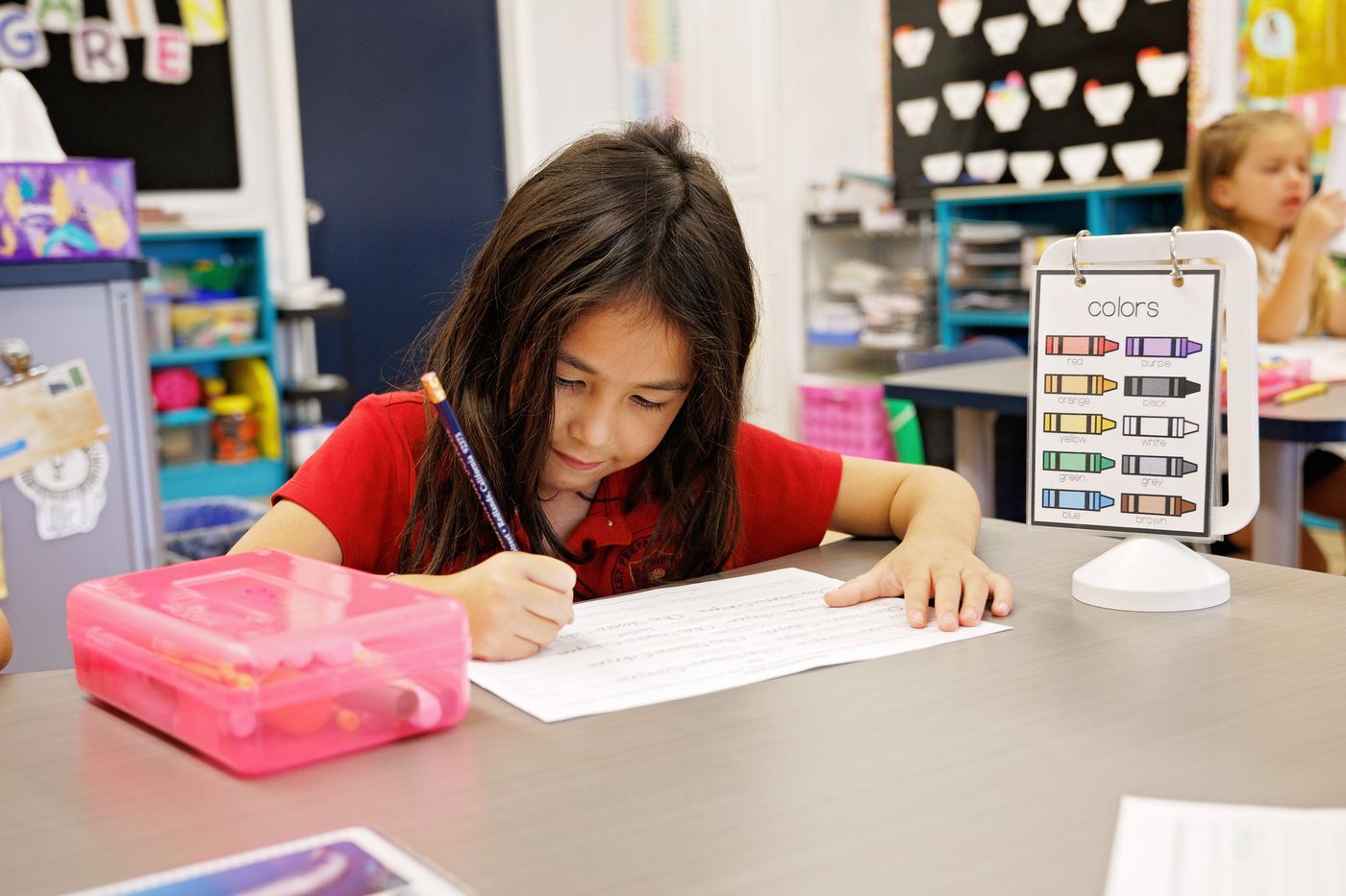 A Valley Prep student works independently on a handwriting exercise