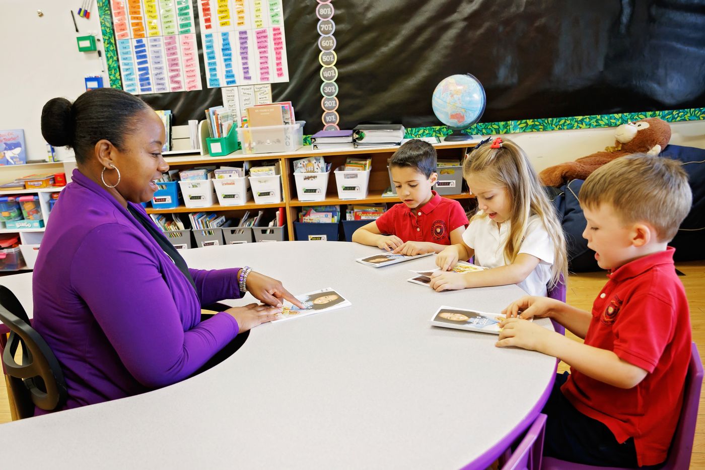 A Valley Prep teacher leads a small-group reading lesson