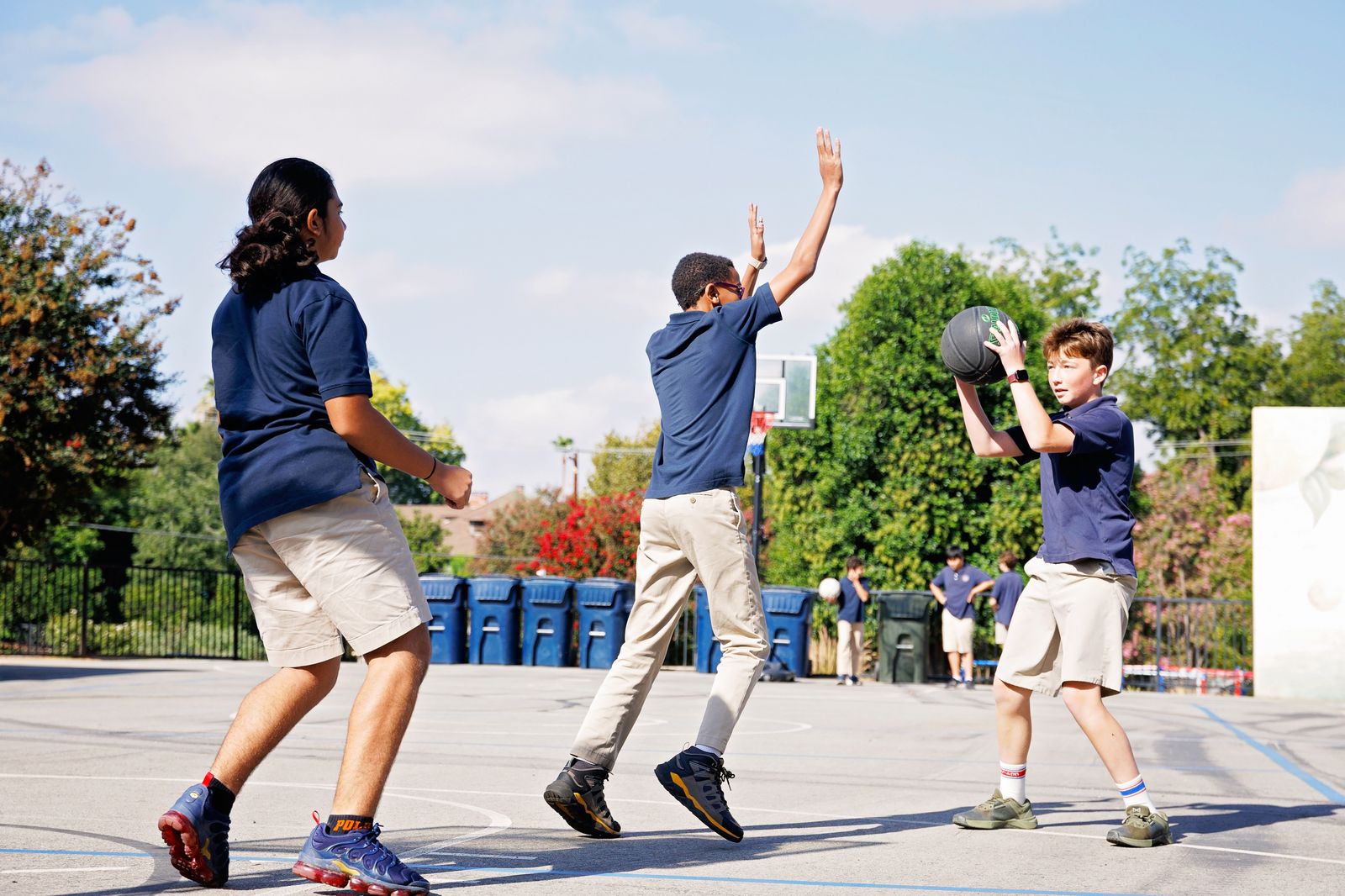 Valley Prep students play a pick-up basketball game on the campus court