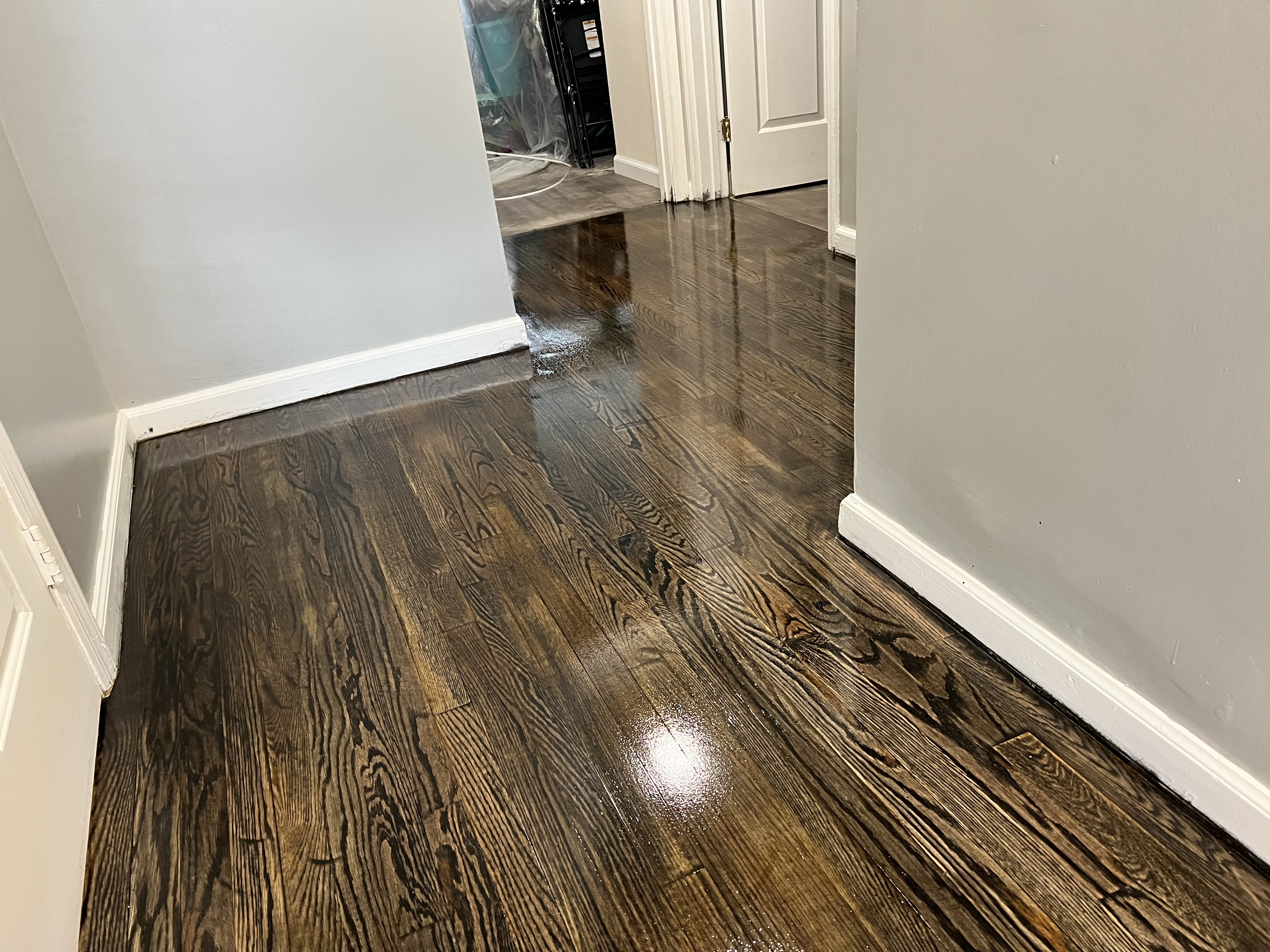Hardwood floor refinishing by Impact Construction LLC
