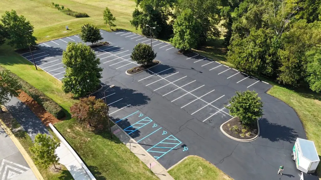 Aerial view of freshly painted parking lot with handicap stalls