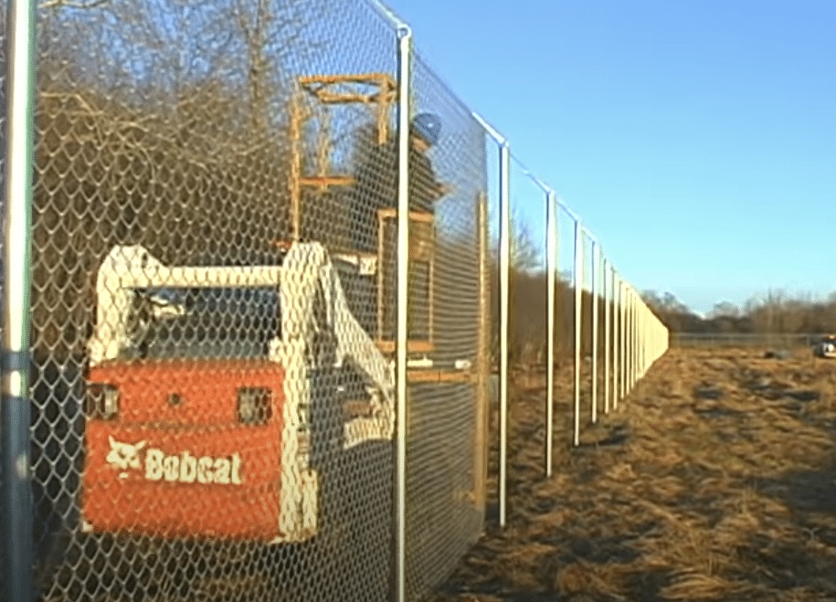 Long perimeter fence installation with Bobcat equipment