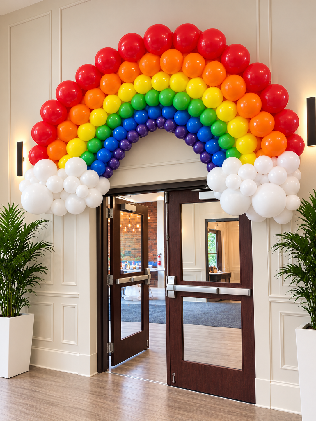 Rainbow Balloon Arch over Entrance Doors