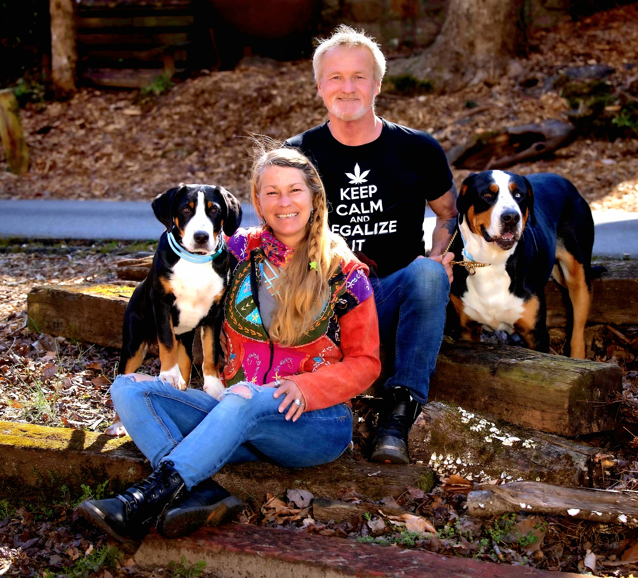 Bear Creek Lodge owners with their dogs on the property