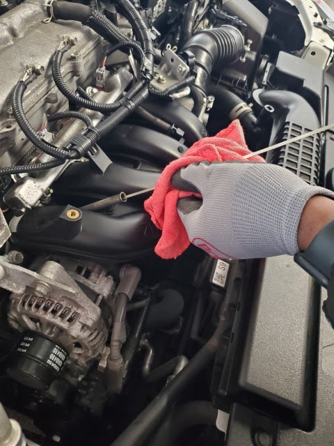 SAP Auto Repair technician working on engine