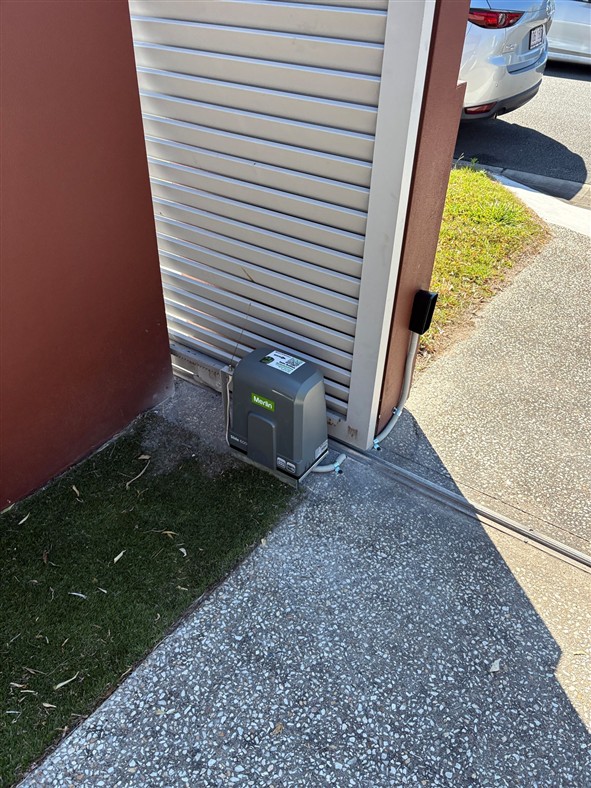 Merlin low voltage slide gate motor with safety beams installed at a Carrara Gold Coast property — Into Action Automation