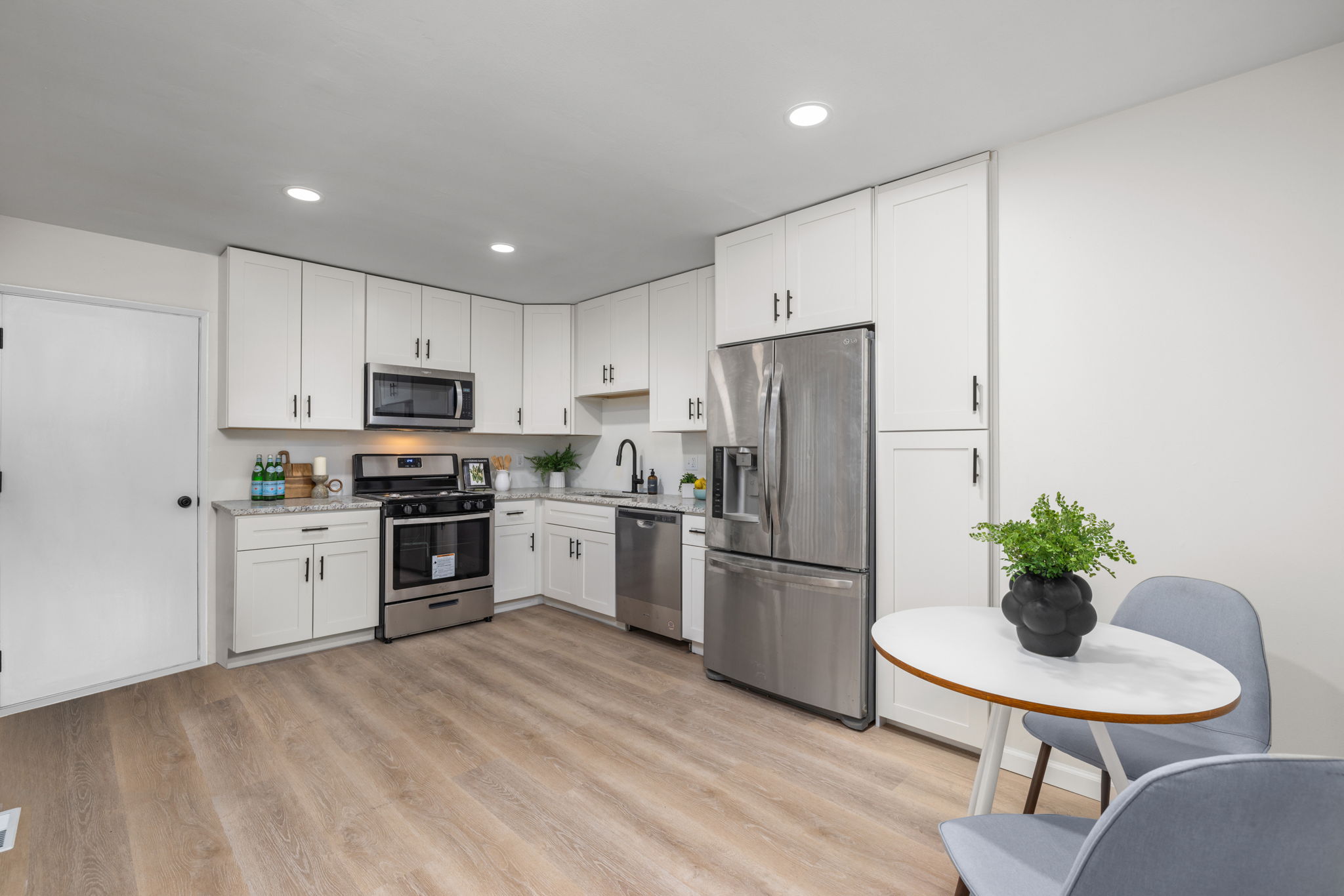 Transitional kitchen with custom cabinetry and recessed lighting