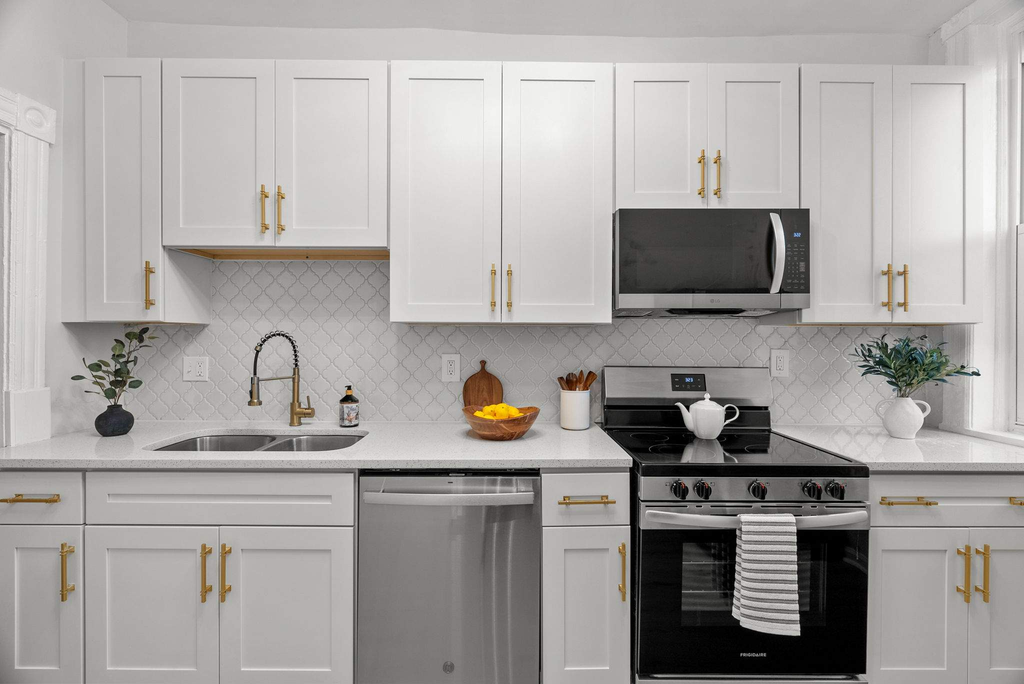 Kitchen cabinet installation with premium hardware and soft-close hinges