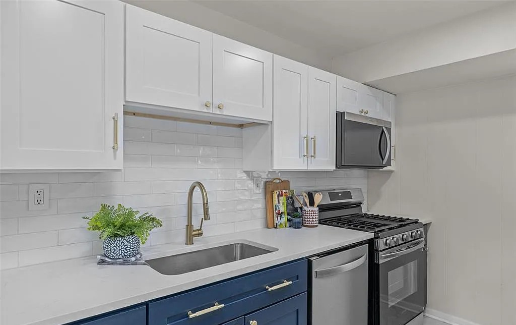 Custom kitchen renovation with granite countertops and stainless steel sink