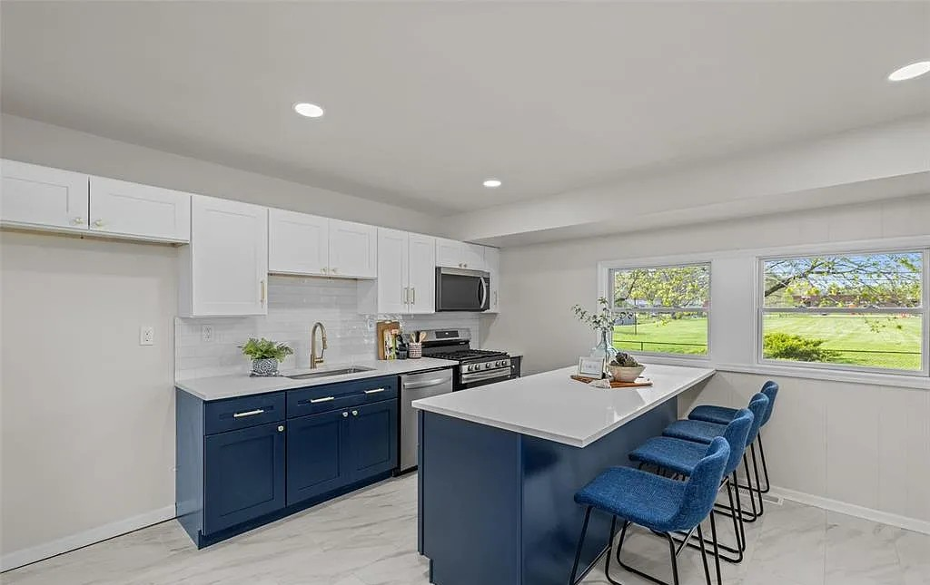 Kitchen remodel featuring luxury vinyl plank flooring and modern lighting