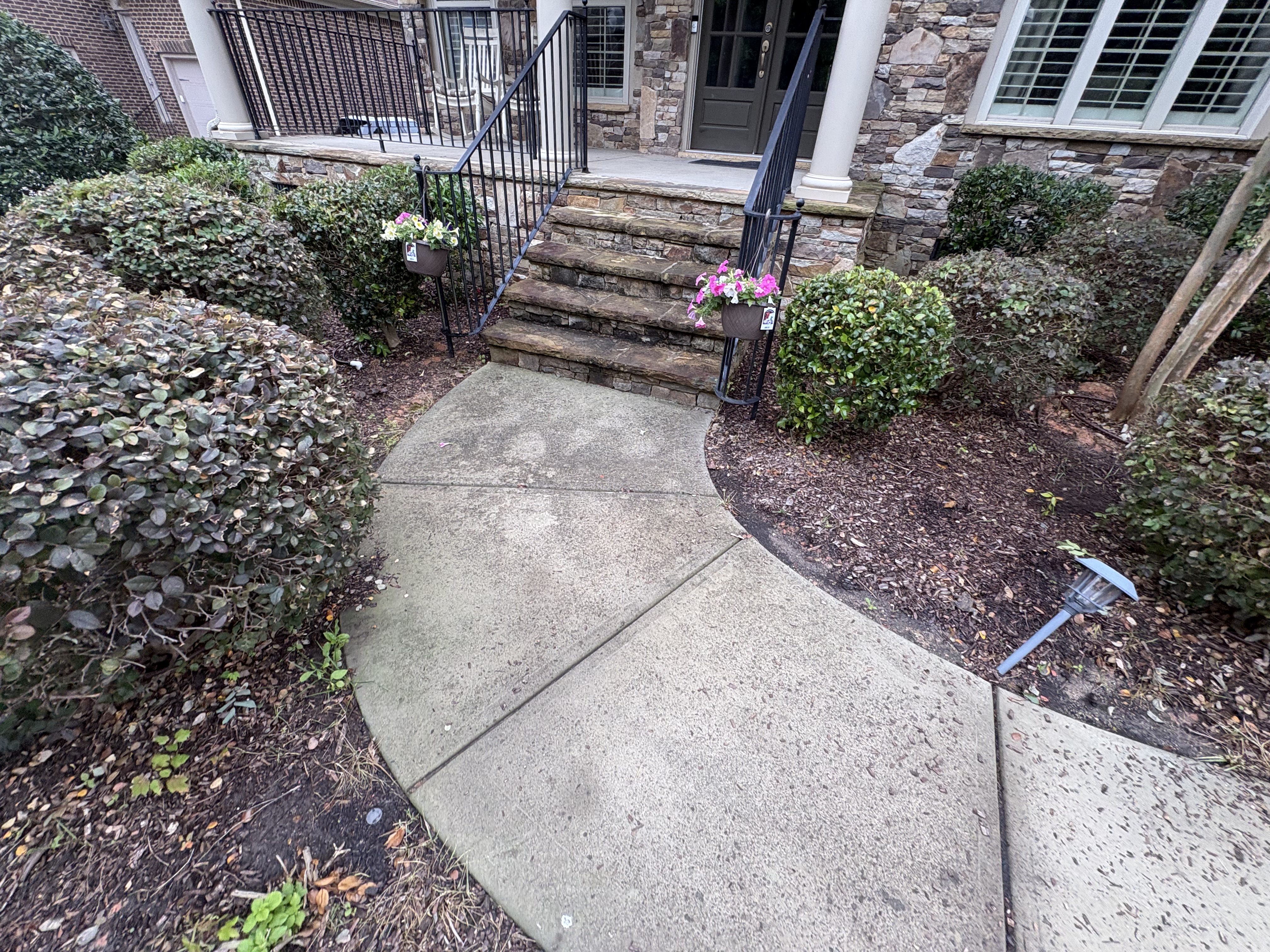 Dirty front walkway and stone stairs before pressure washing by Washing Limitless Rock Hill SC