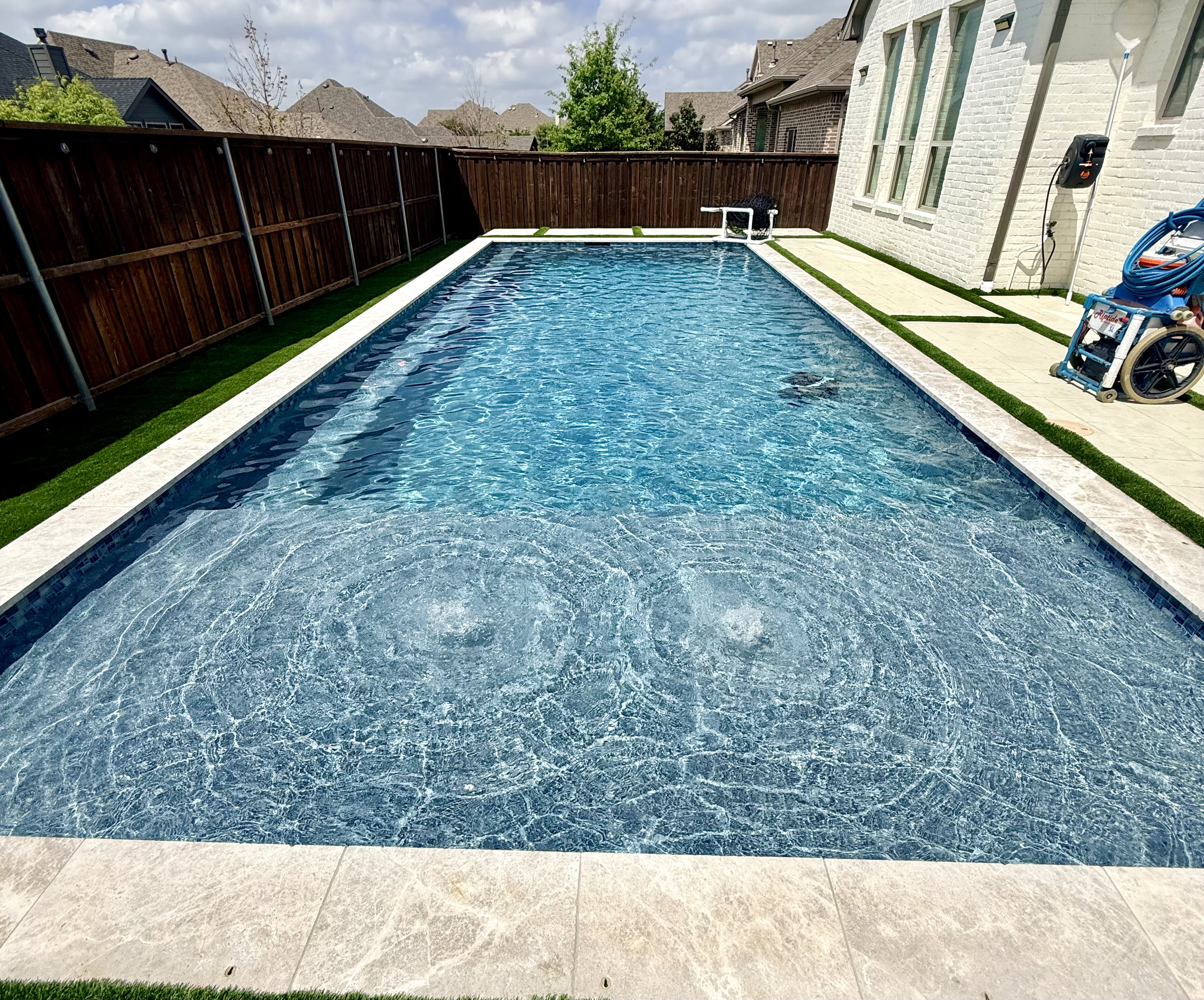 Rectangular lap pool with travertine coping — Prosper TX