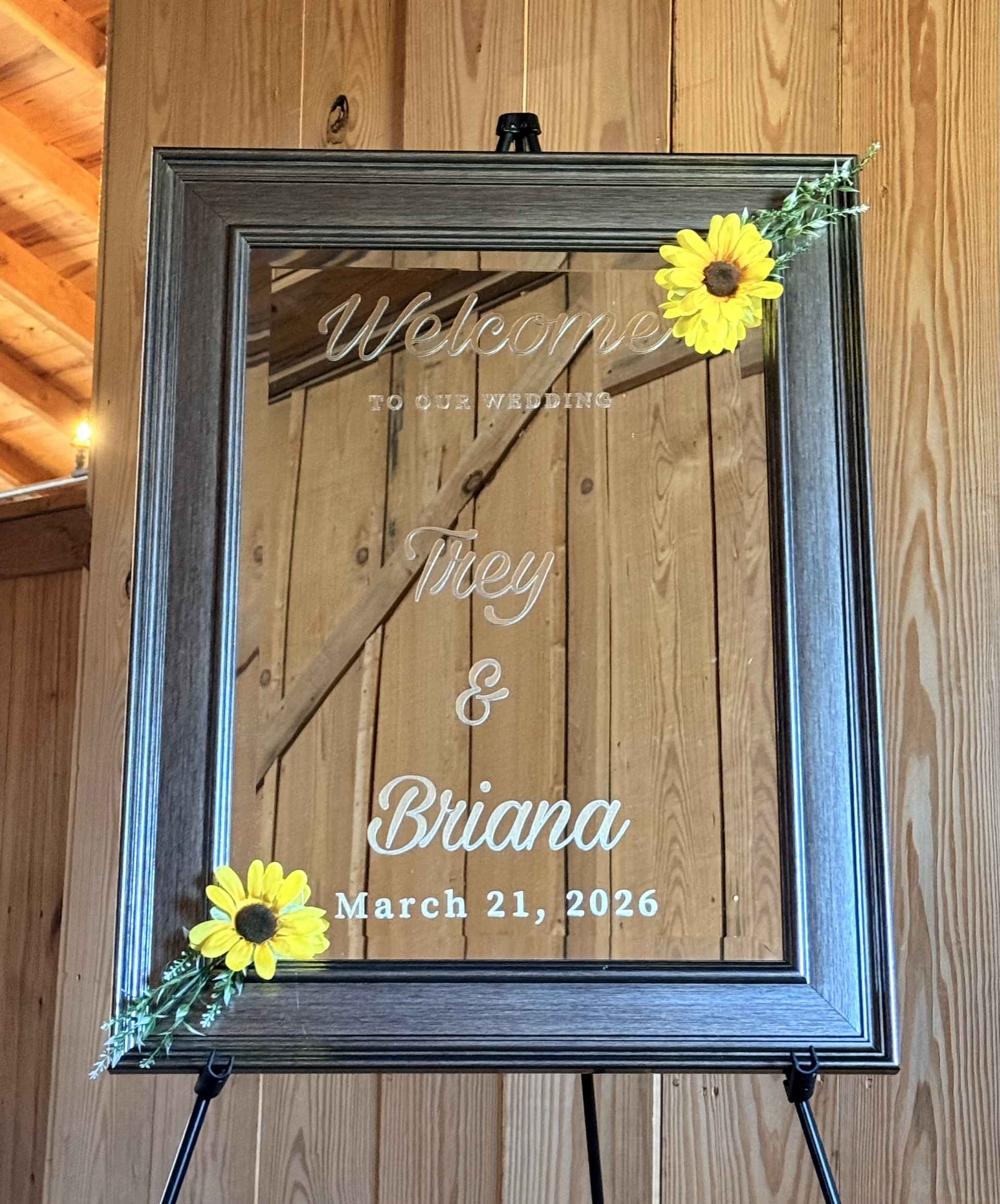 Welcome to our wedding mirror sign with sunflower accents for Trey and Briana March 21 2026 at rustic barn venue in DFW