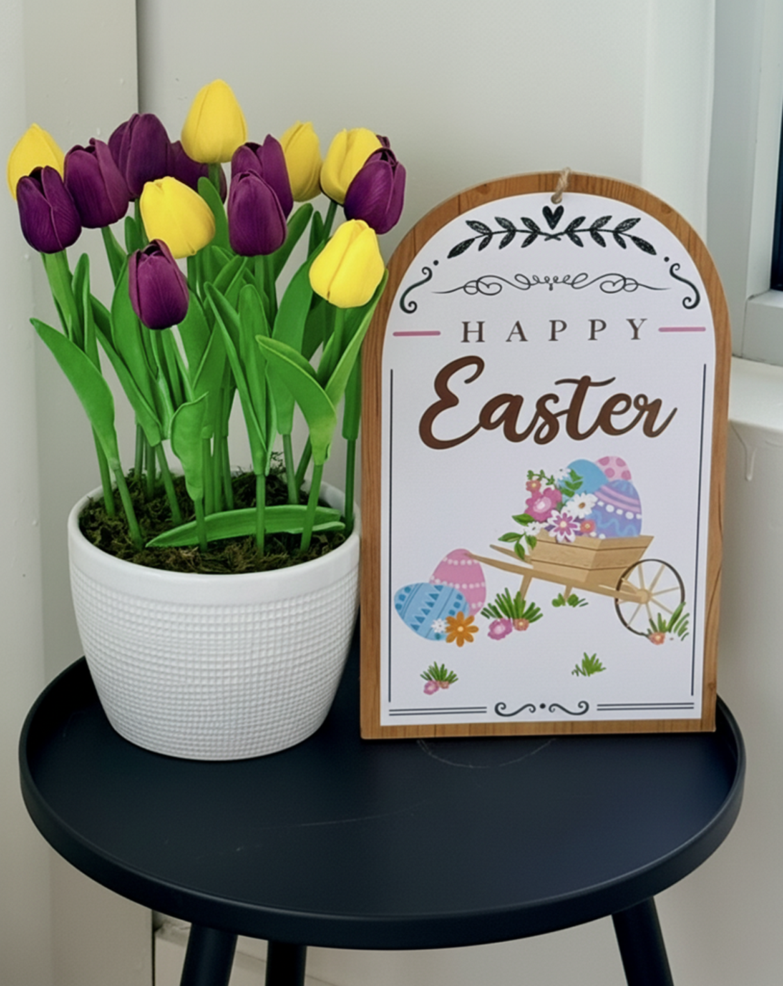 Purple and yellow tulip arrangement in white pot with moss by Petal Essence in Dallas-Fort Worth