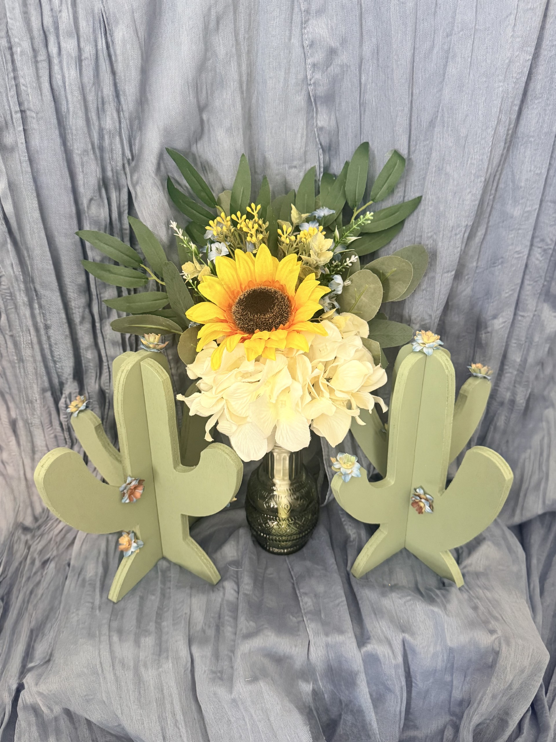 Bridesmaid bouquet with sunflower, hydrangeas, eucalyptus, and cactus accents by Petal Essence in Dallas-Fort Worth