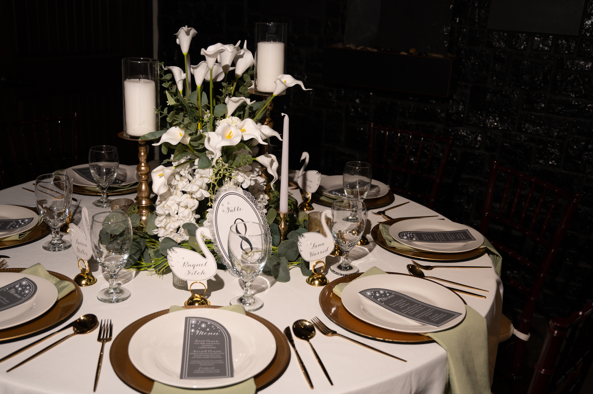 Elegant wedding reception table setting with calla lilies