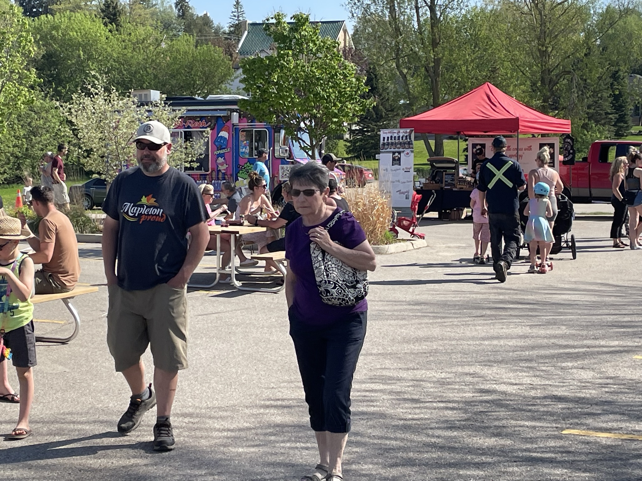 Busy community festival with food trucks