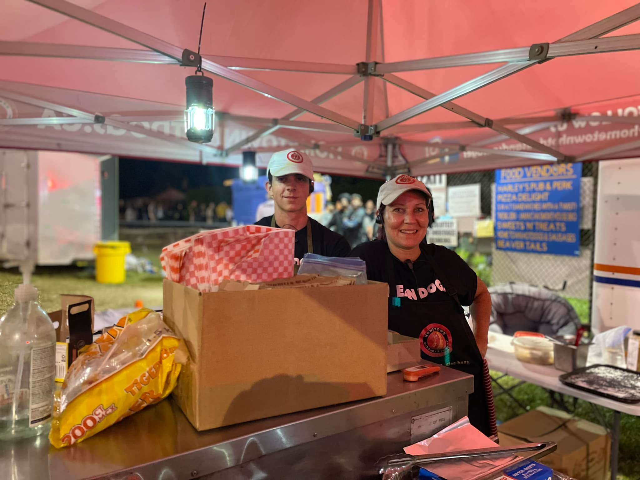 Christian and his wife at the Hometown Hot Dogs tent