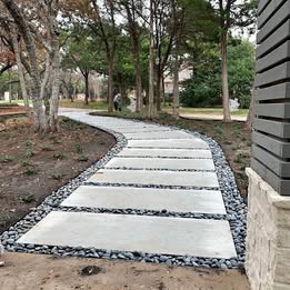 Curved walkway with river rock