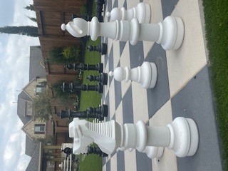 Giant chess set on paver patio