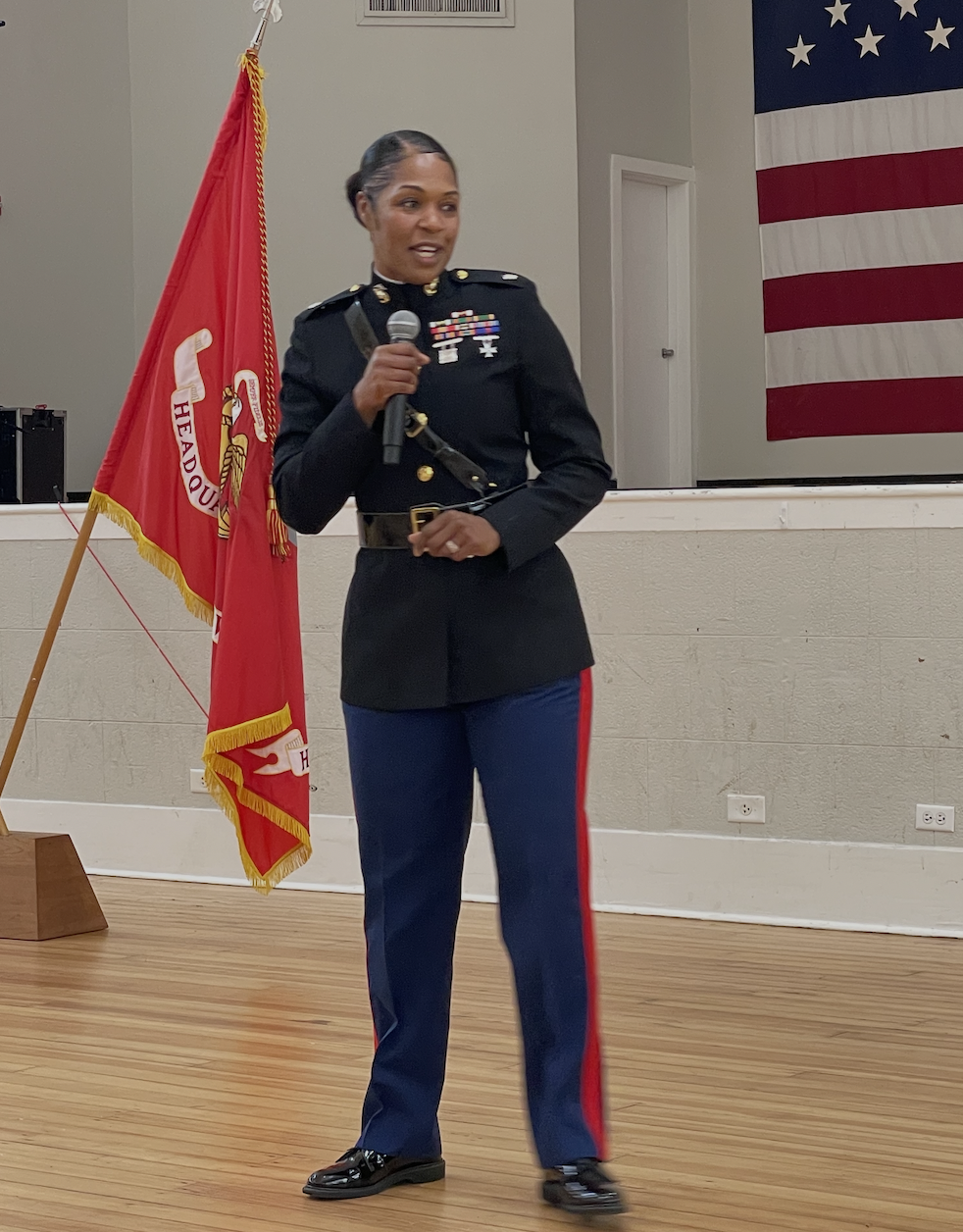 Shanelle Porter Simmons speaking in Marine Corps dress uniform