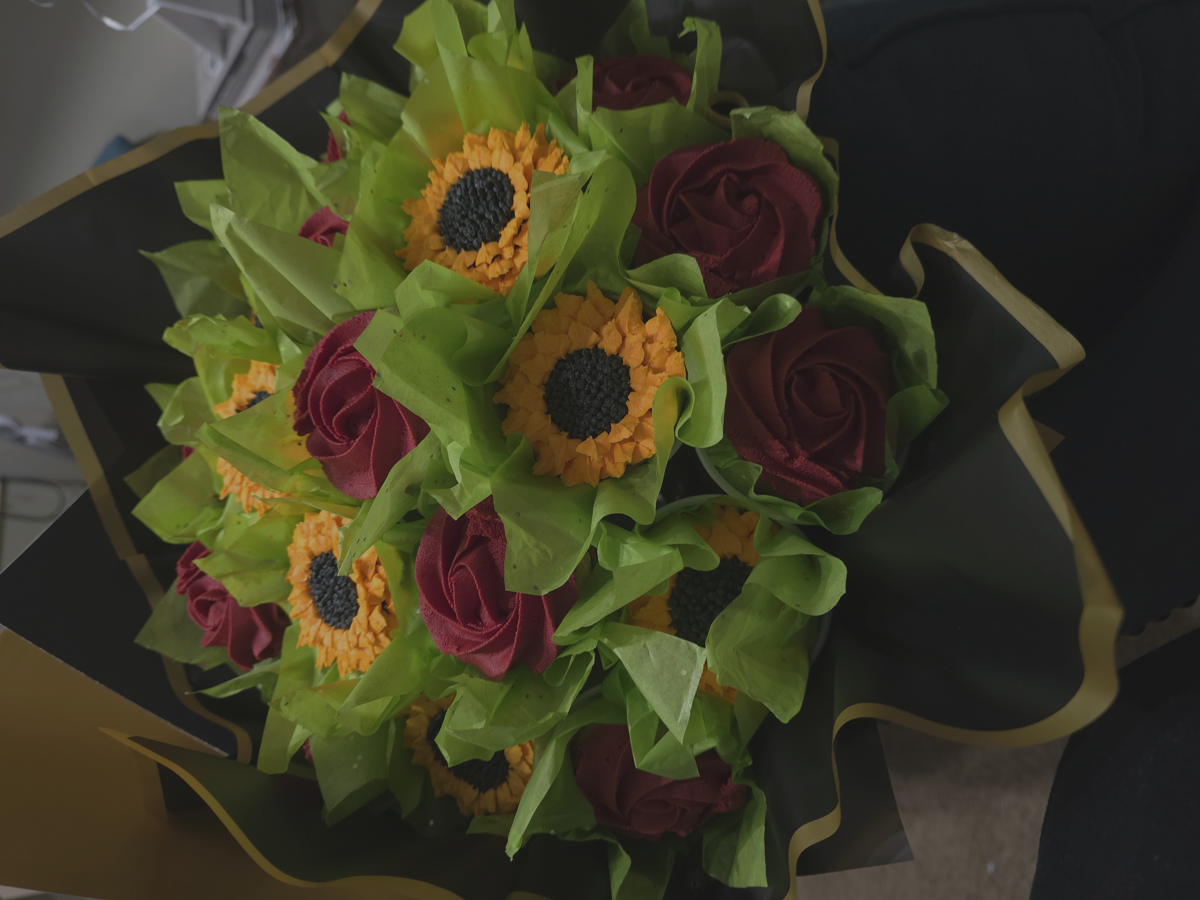 Cupcake bouquet with sunflowers and roses
