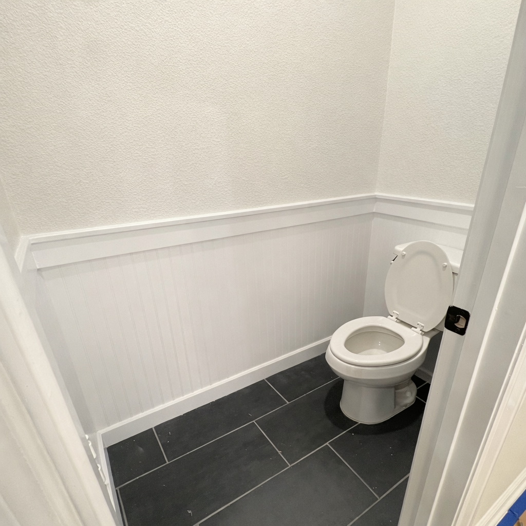 After — completed wainscoting and trim