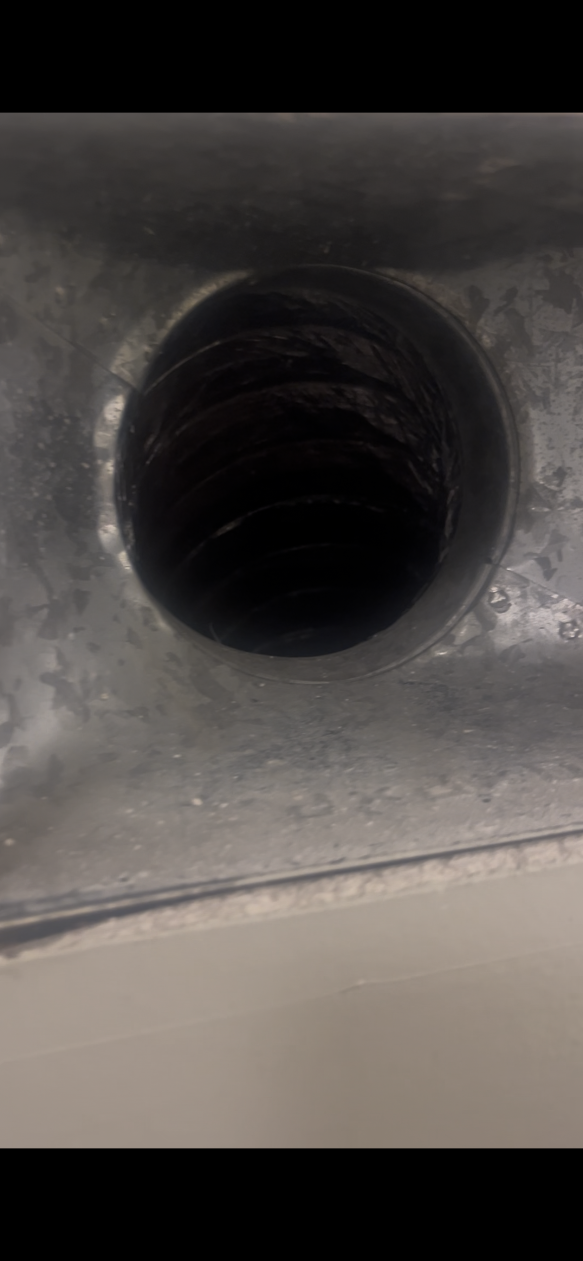 Inside of a dirty air duct before cleaning