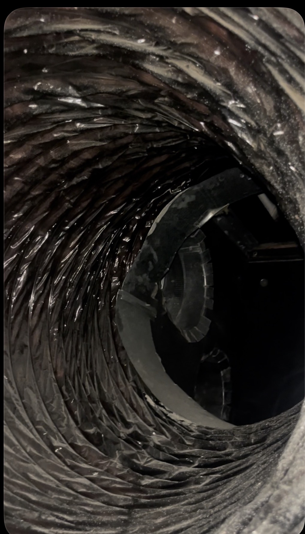 Inside view of ductwork showing dust and debris