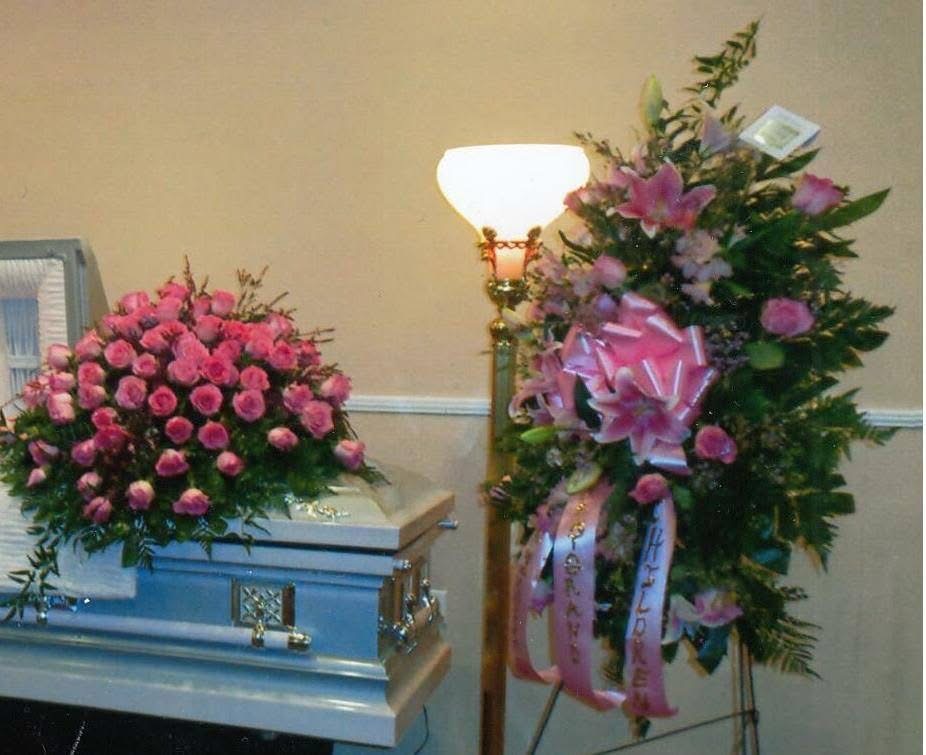 Pink rose casket and standing spray set