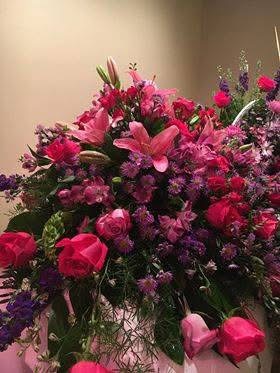 Hot pink roses and lilies casket spray