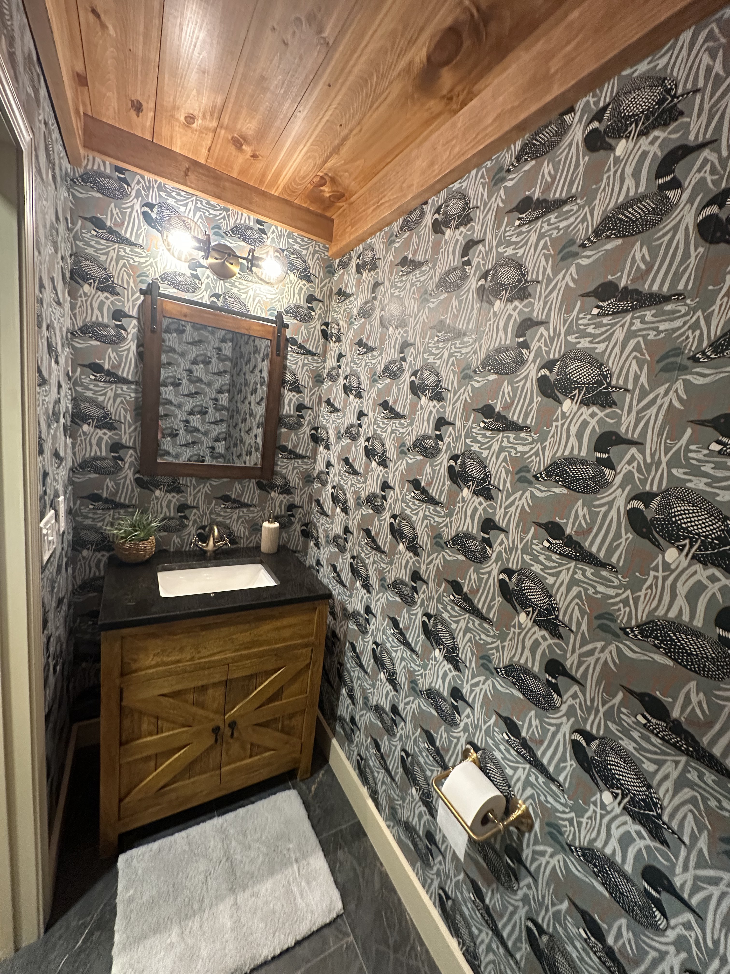 Powder room with designer wallpaper