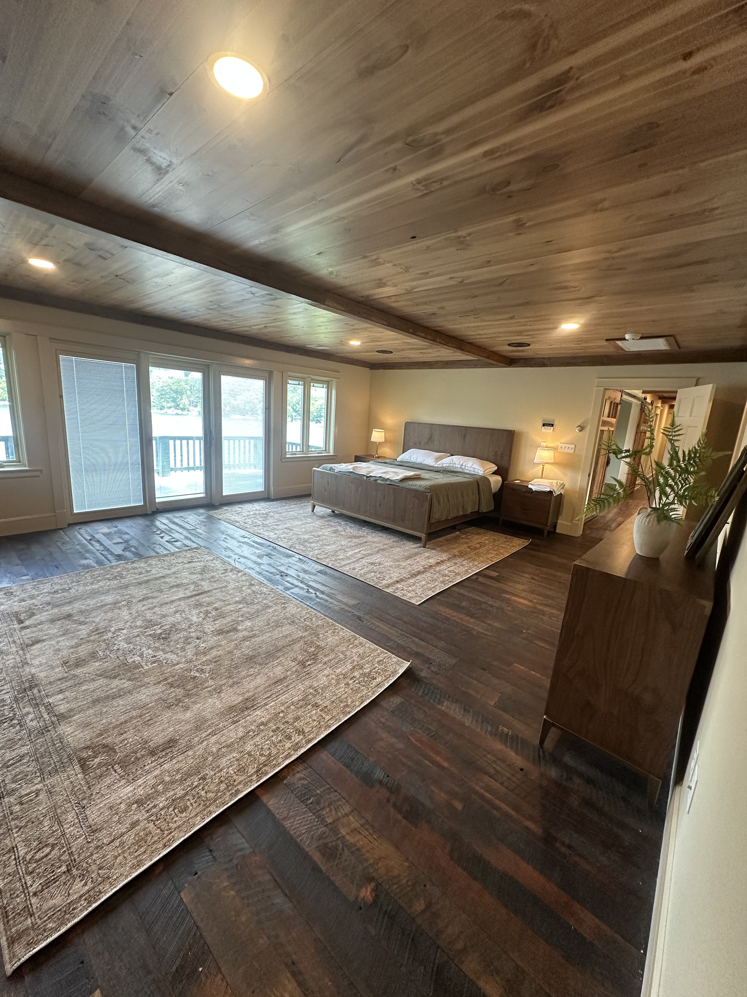 Master suite with exposed beam ceiling